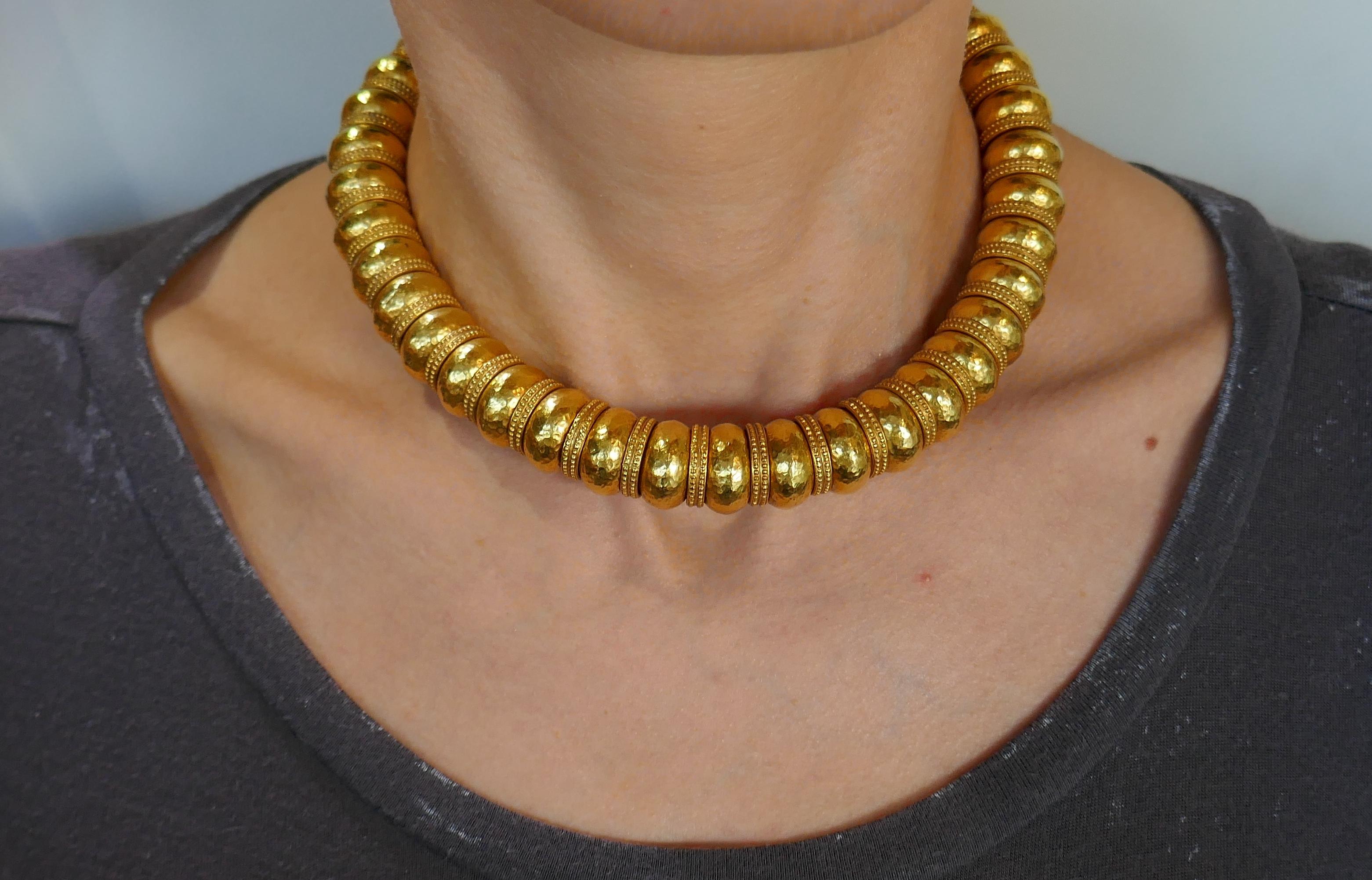 Fabulous necklace created by a Greek designer Ilias Lalaounis. Bold and wearable, the necklace is a great addition to your jewelry collection. 
Made of 22 karat (stamped) yellow gold. 
The necklace measures 15-1/8 x 5/8 inches (38 x 1.4 cm) and