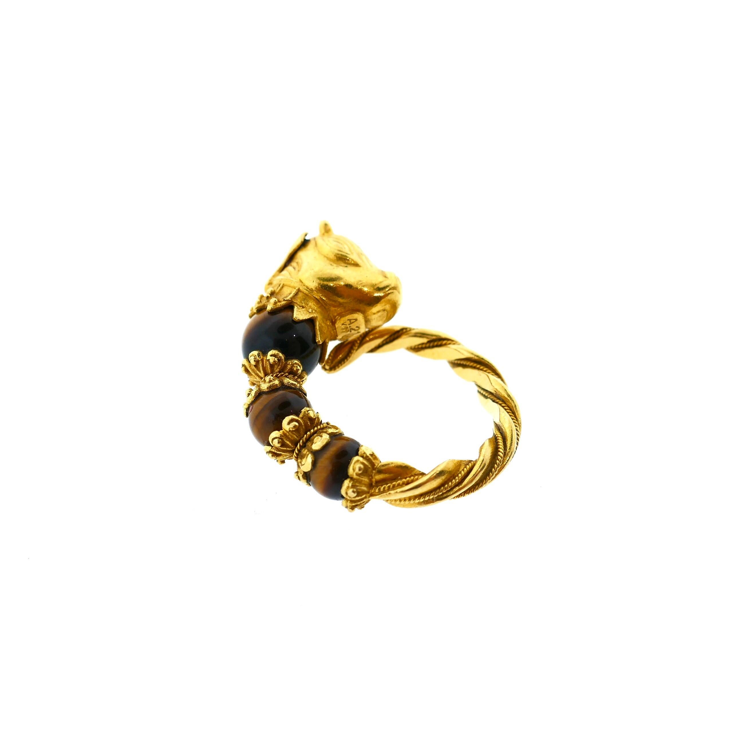 Lalaounis 22 Karat Yellow Gold Tiger Eye Emerald Bull Head Ring

This is a beautiful bull motif ring by the famous Greek jewelry house Lalaounis. It features rich 22 karat yellow gold, tigers eye, and an emerald all in an intricate greek motif. A