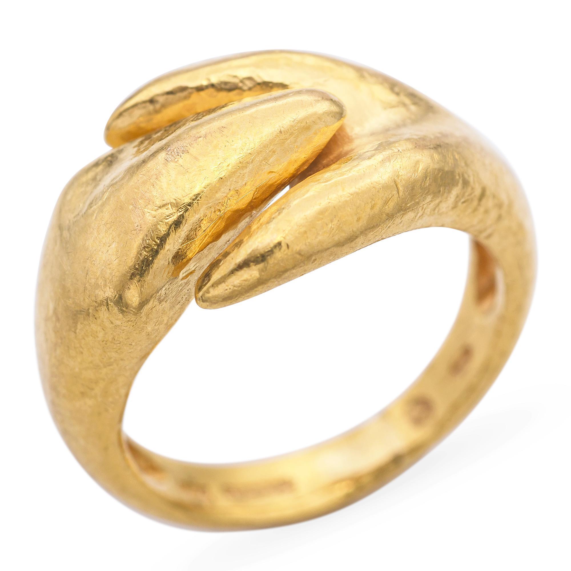 This vintage Ilias Lalaounis ring, crafted in 18k yellow gold, exemplifies the designer's signature fusion of ancient inspiration and modern artistry. The piece features an organic, sculptural form with a hammered texture, reflecting Lalaounis's