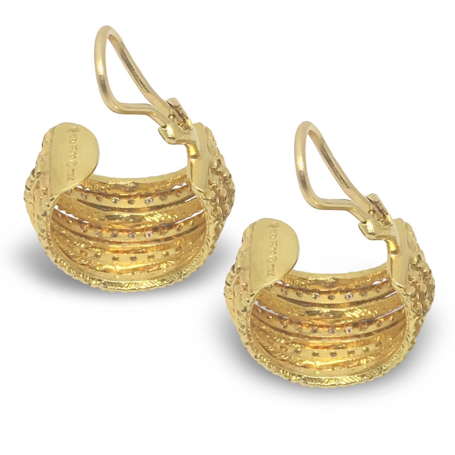 Earrings in 18k yellow gold with touches of diamonds from the Africa Collection. 
Diamond: Total weight: 0,57 carats

Depending on availability it may take 2 weeks to have the item ready to be shipped.
Posts can be added upon request.