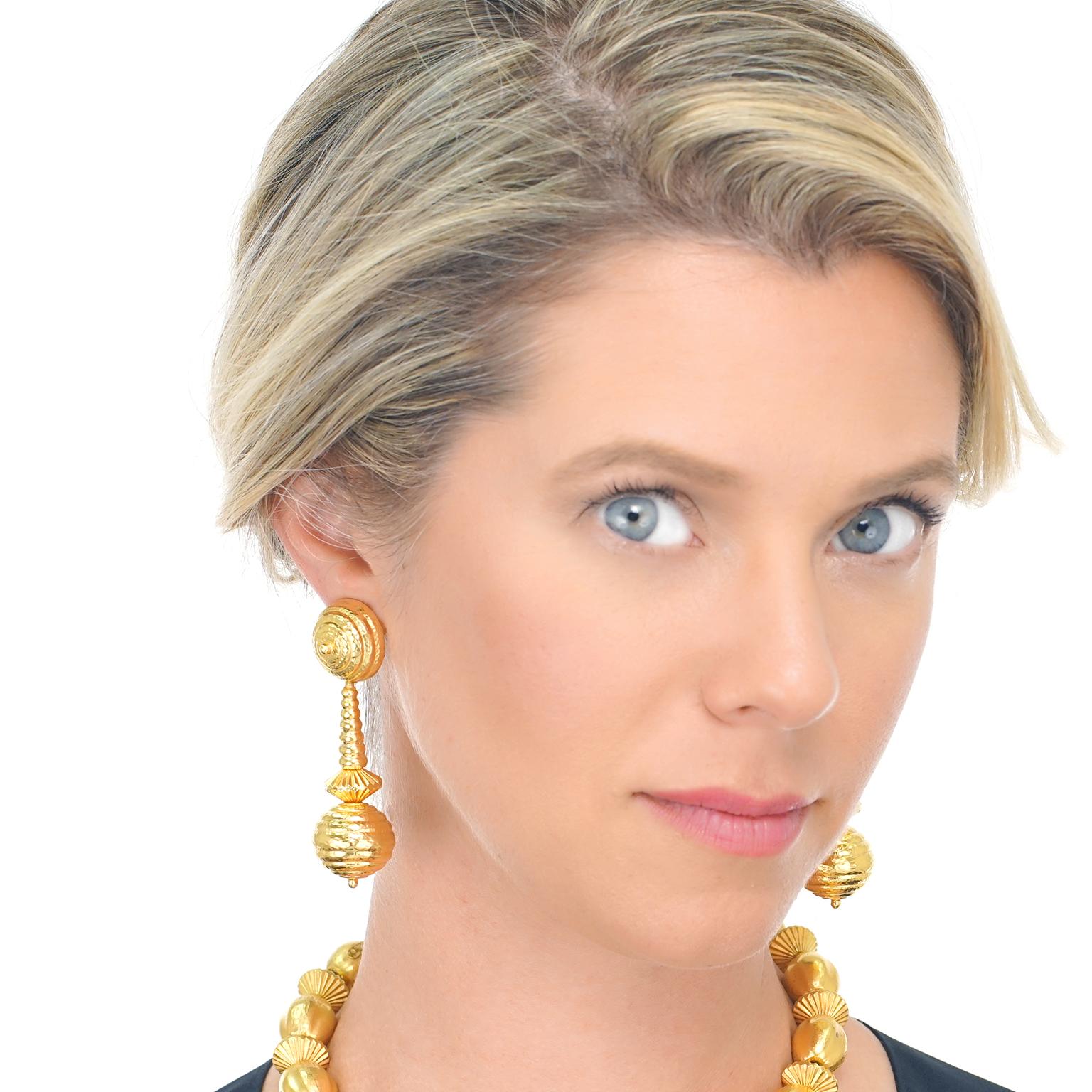 Circa 1960s, 22k, by Ilias Lalaounis, Greece.  These boldly stylish gold earrings by Lalaounis revive classic Mycenaean motifs for a look that is as chic as it is timeless. Ilias Lalaounis' vision to create jewelry based on classical, archaic, and