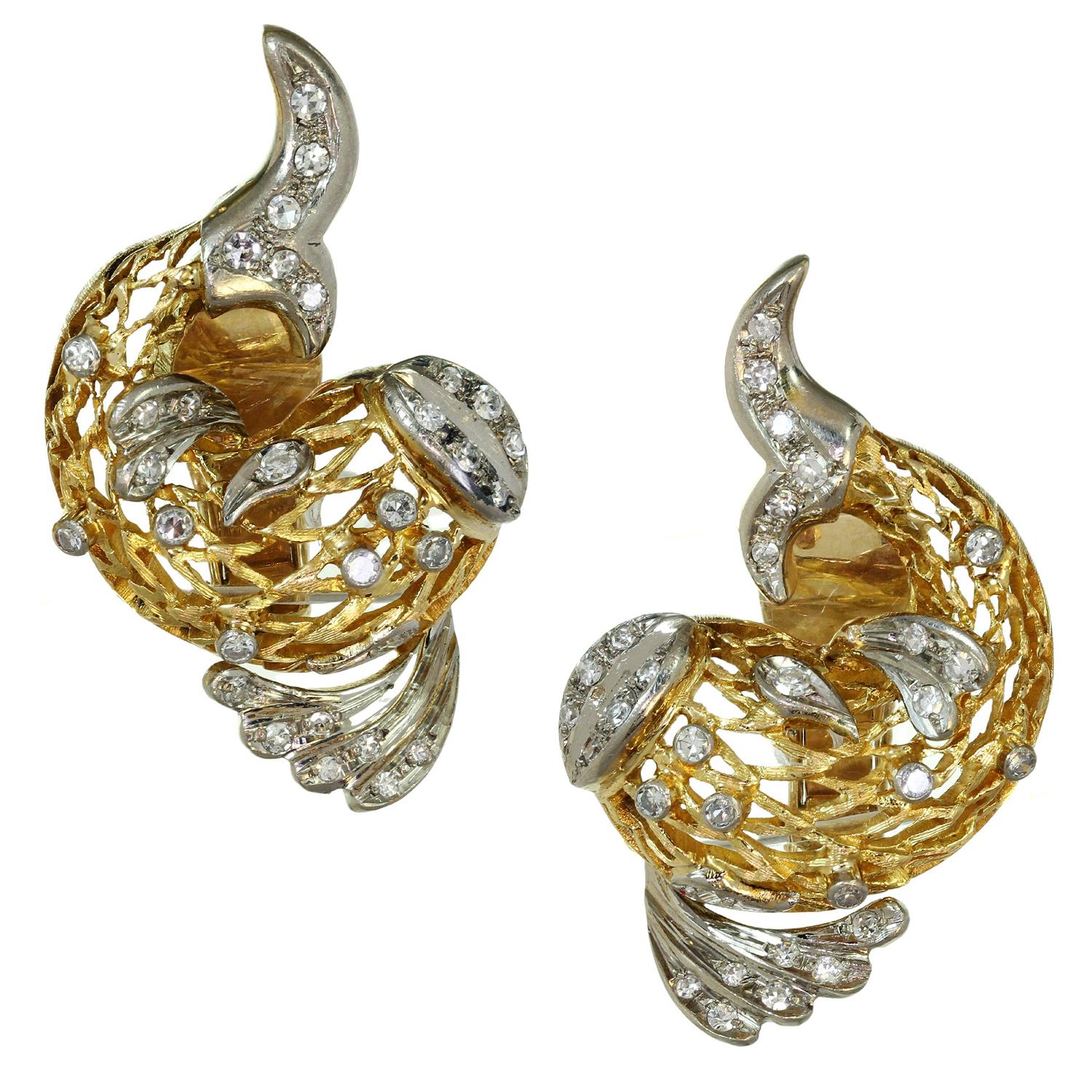 These fabulous Ilias Lalaounis clip-on earrings feature a chic dolphin design crafted in 18k yellow gold, accented with white gold and set with single-cut G-H-I VS1-VS2 round diamonds weighing an estimated 1.0 carats. Signed Ilias Lalaounis, with