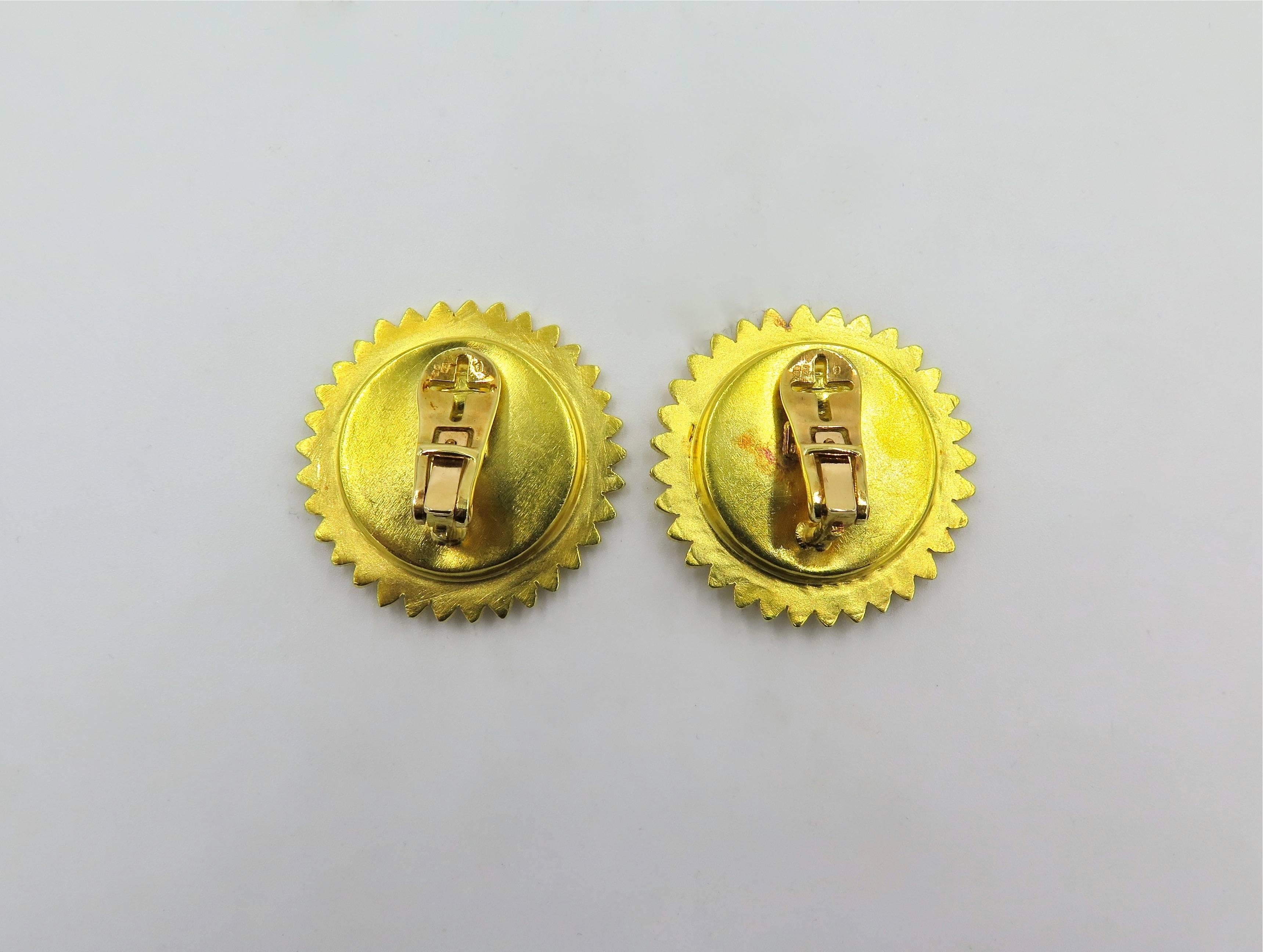 A pair of 18 karat yellow gold earrings. Lalaounis. Each disc designed as a floral spray. Diameter is approximately 1 1/4 inches. Gross weight is approximately 22.4 grams.  