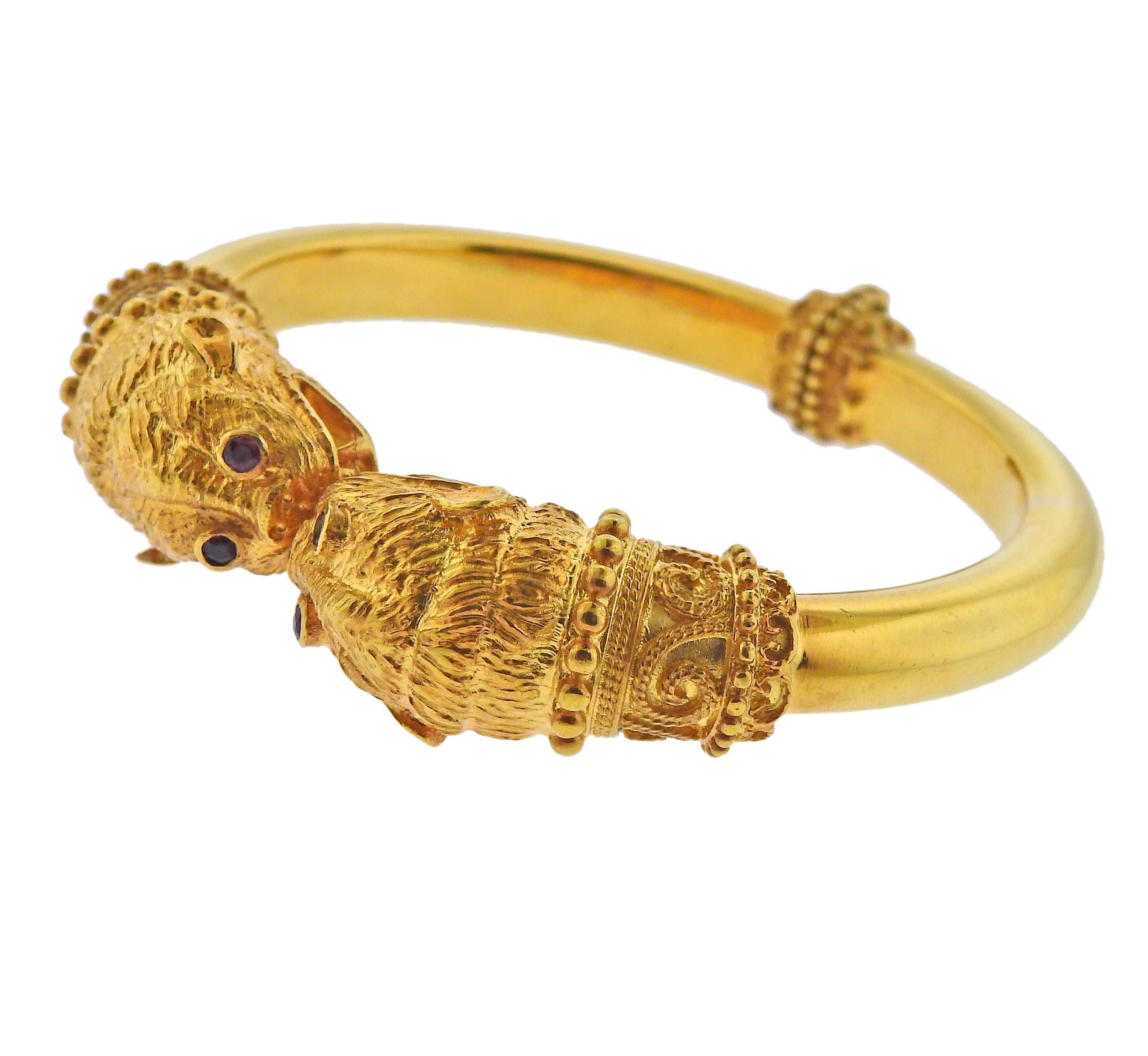 Iconic Chimera bracelet in 18k yellow gold by Ilias Lalaounis with ruby eyes. Bracelet will fit approx. 7