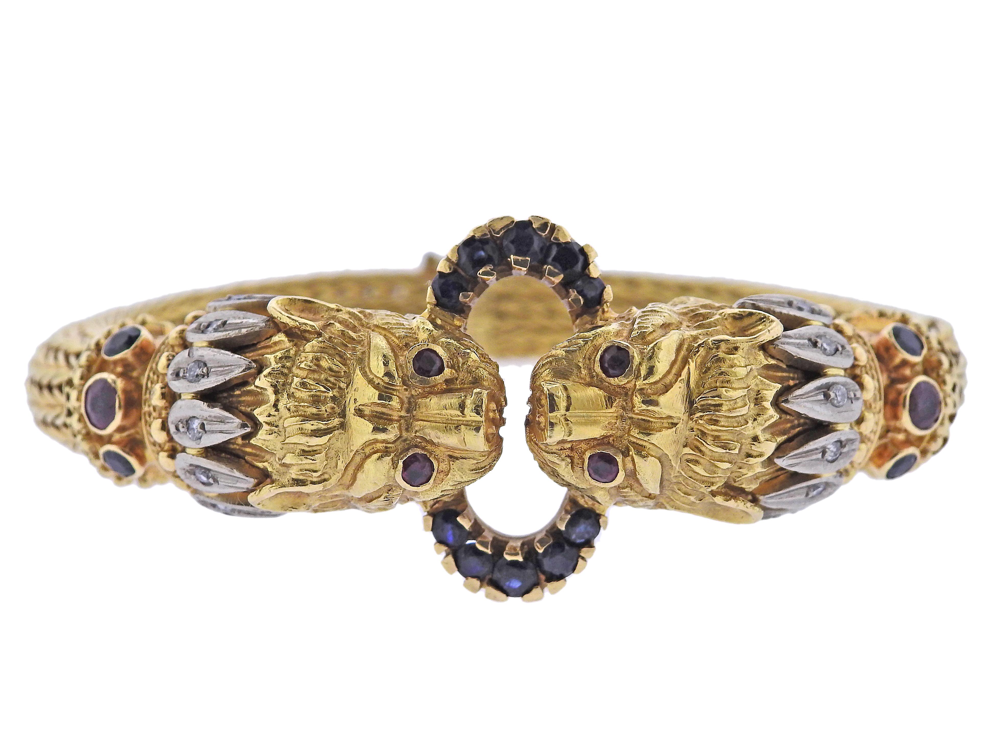 Classic Chimera 18k gold bracelet by Greek designer Ilias Lalaounis, adorned with approx. 0.08ctw H/VS diamonds, rubies and sapphires. Bracelet will fit approx. 7-7.25