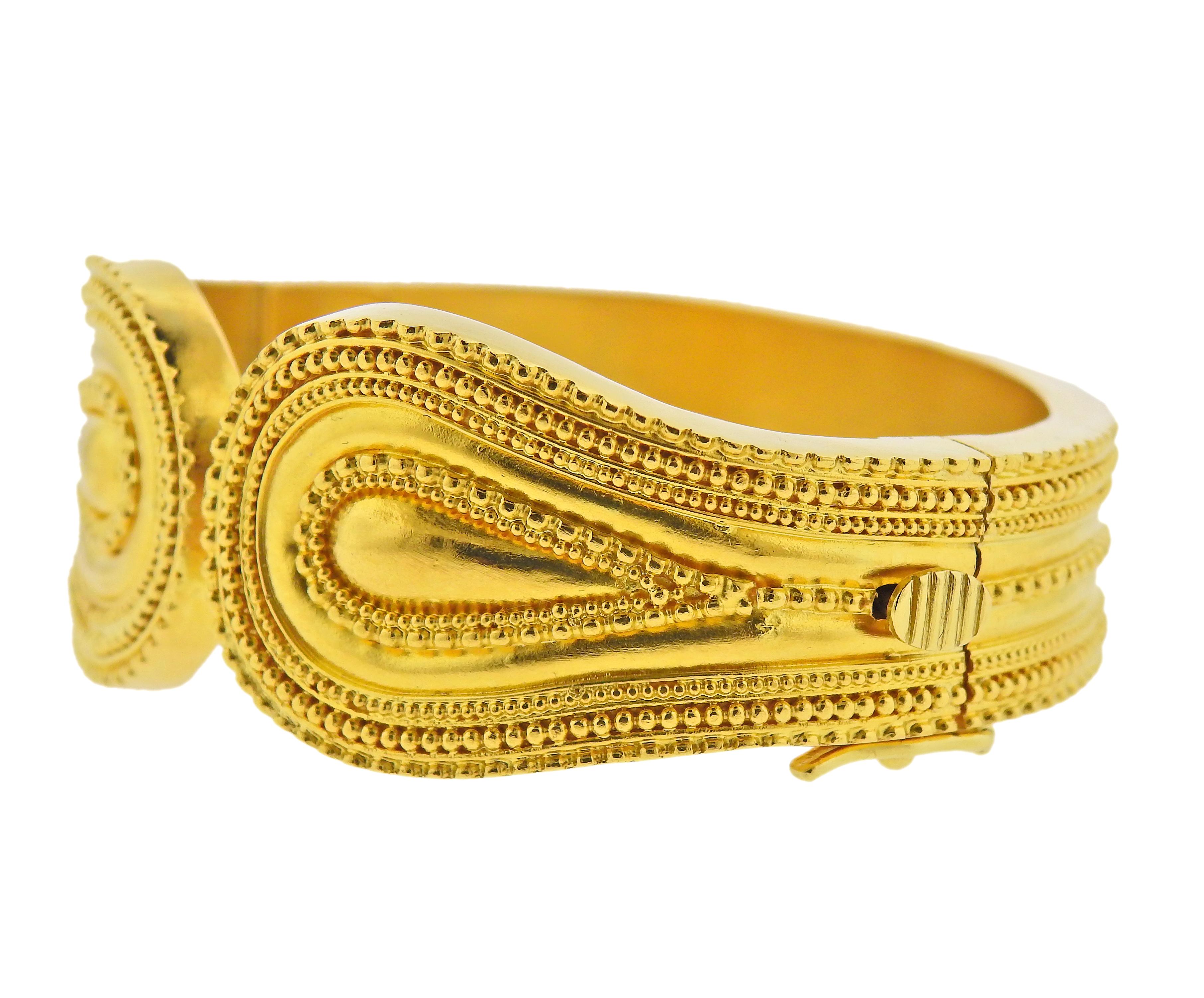 18k yellow gold cuff bracelet by Greek designer Ilias Lalaounis. Bracelet will fit approx. 6.75