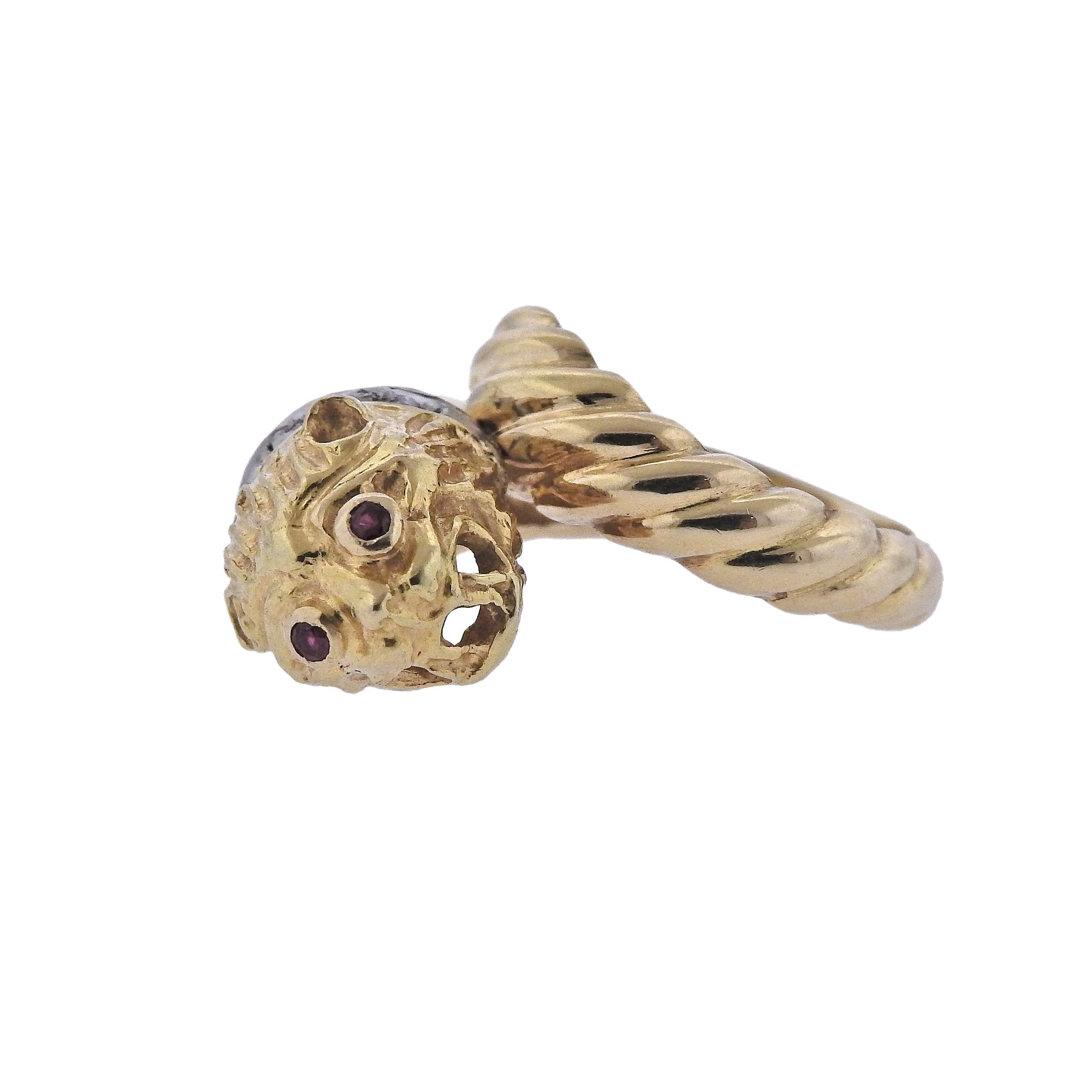 18k yellow gold Chimera ring, crafted by Ilias Lalaounis, set with approx. 0.05ctw diamonds and ruby eyes.  Ring size - 5, ring top is 15mm wide, sits approx. 12mm from the top of the finger, weighs 9.7 grams. Marked: A21 750, Greece, Maker's mark.