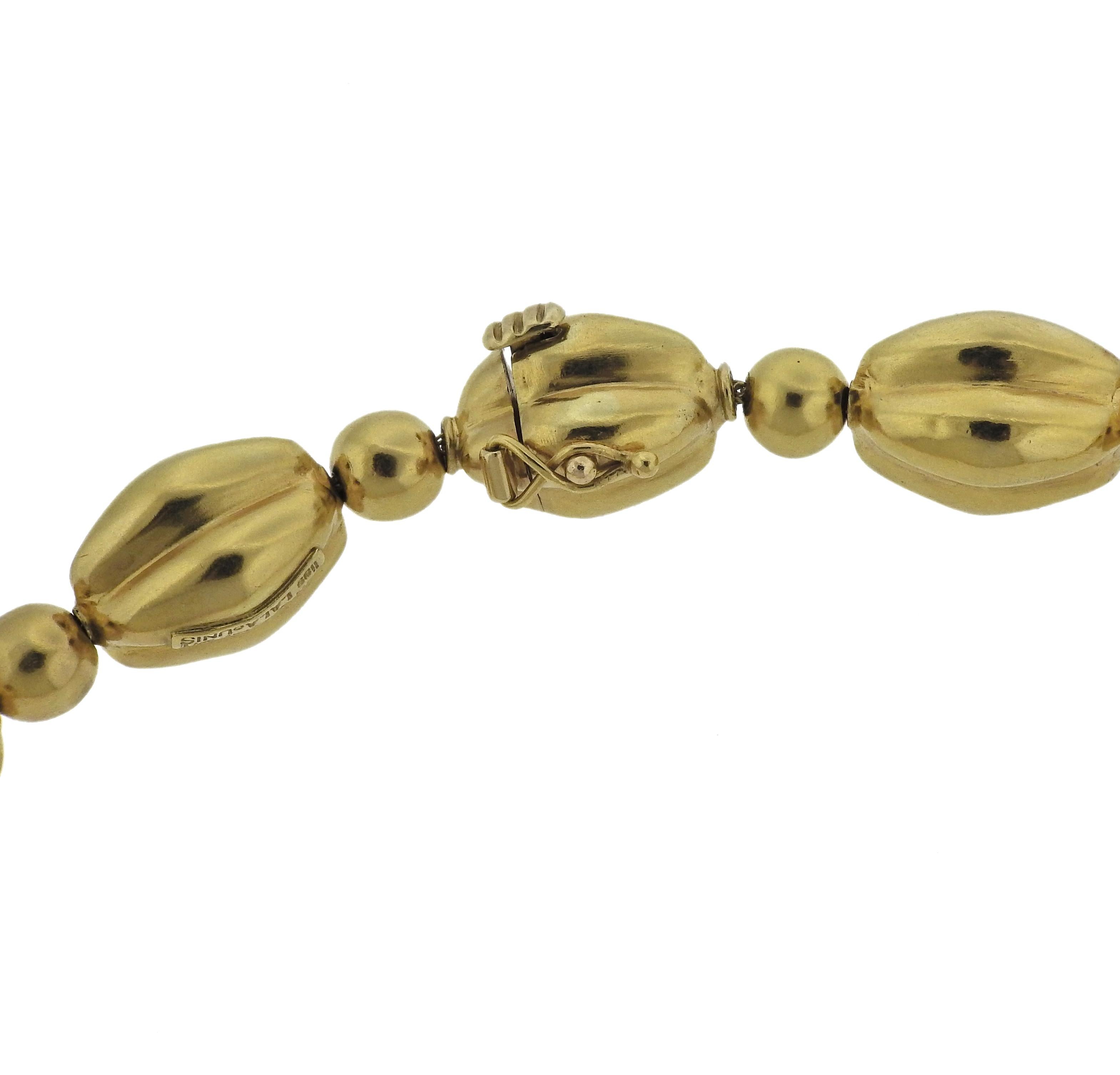 22k yellow gold necklace by Greek designer Ilias Lalaounis, featuring detachable portion to wear at different lengths. Necklace is 24.5