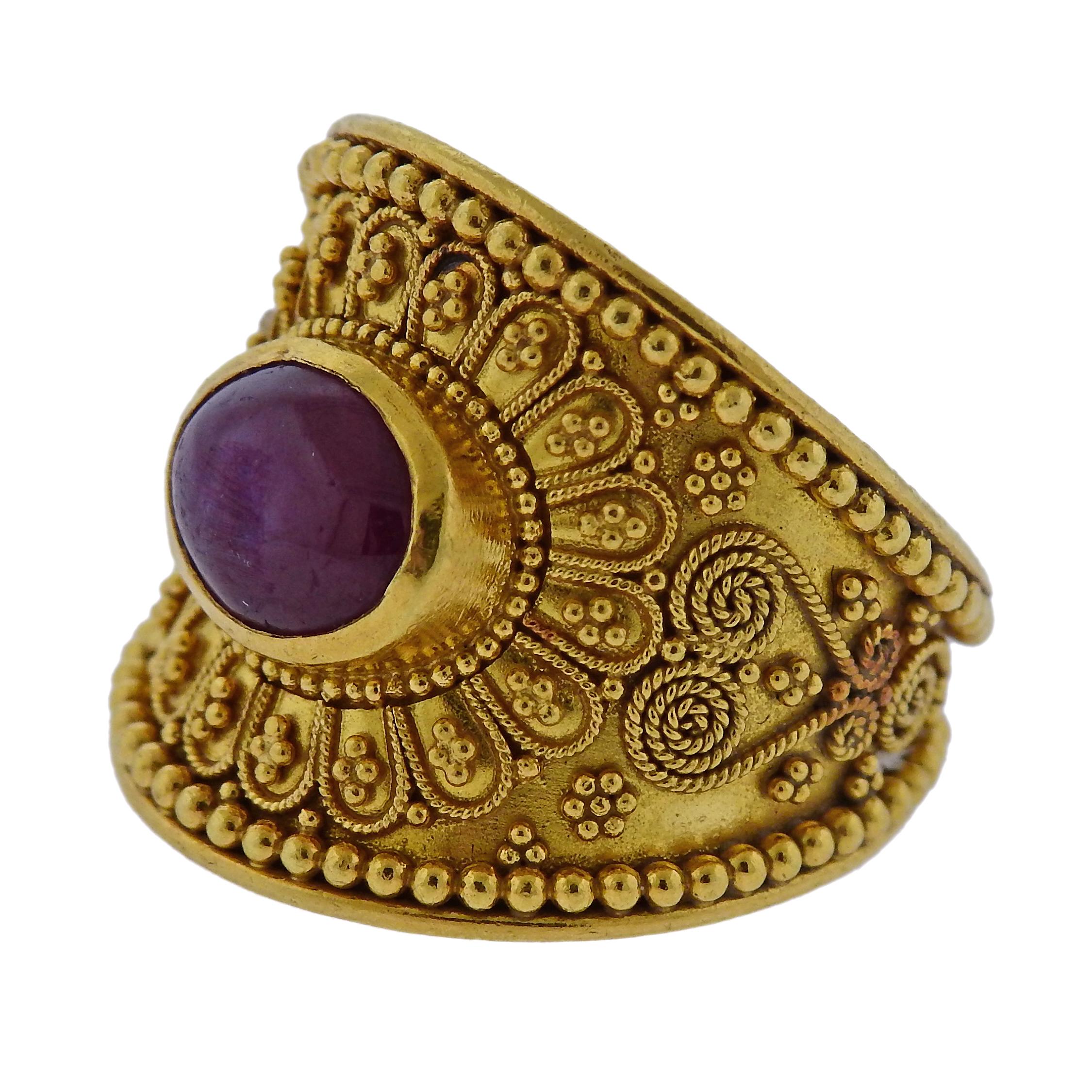 18k yellow gold wide band ring, crafted by Greek designer Ilias Lalaounis, set with 9.5mm x 7mm ruby cabochon. Ring size - 9, ring top is 20mm wide, weighs 13 grams. Marked: H.17750, Greece, Maker's hallmark.