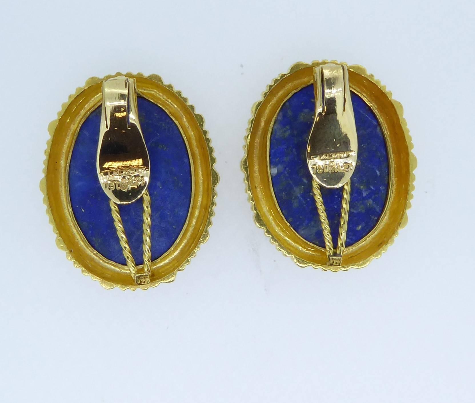 Lalaounis Lapis Lazuli And 18 Carat Yellow Gold Oval Ear Clips. The oval lapis lazuli framed by ribbed yellow gold. Vintage. Each earring with maker's mark for Lalaounis