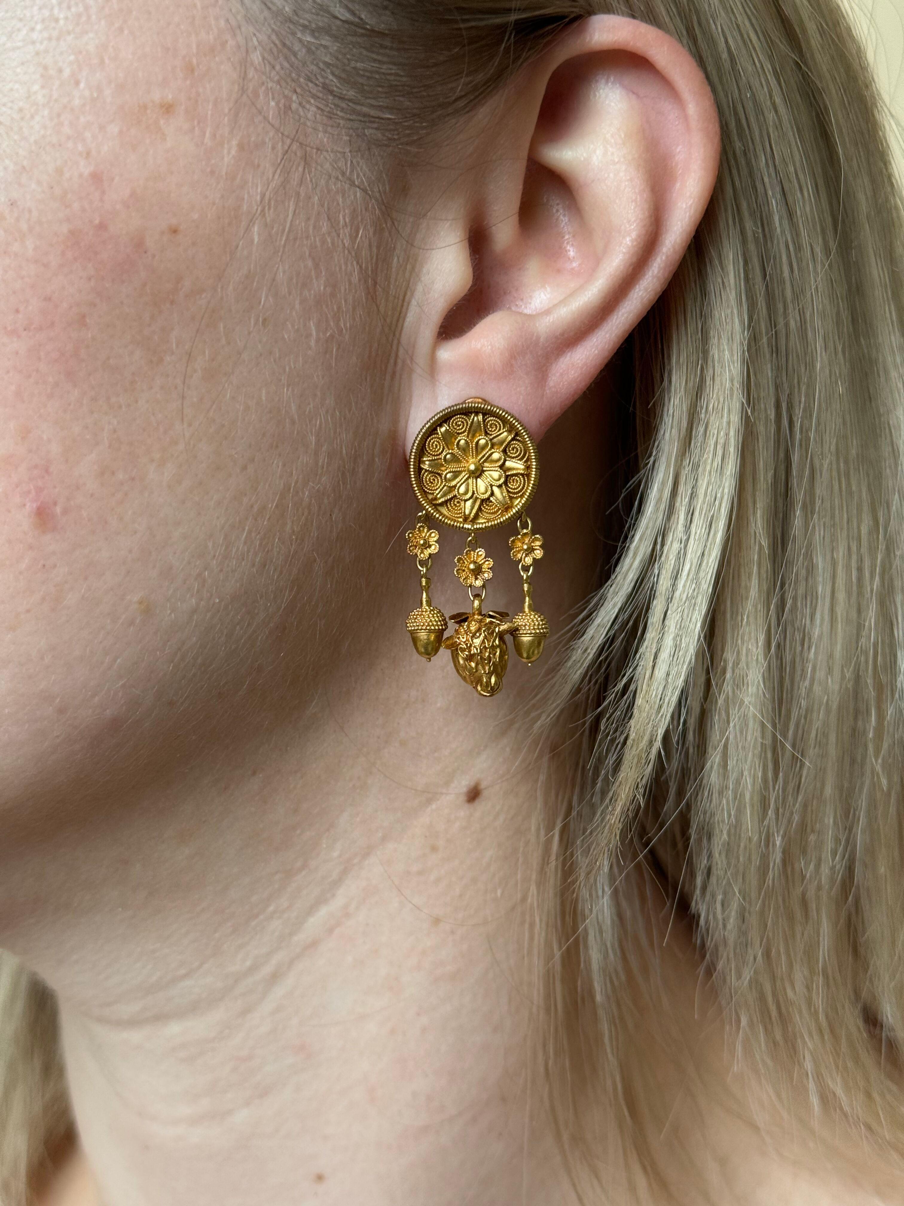 Pair of iconic 22k yellow gold earrings by Ilias Lalaounis of Greece, depicting acorn and bull. The earrings are 1 5/8