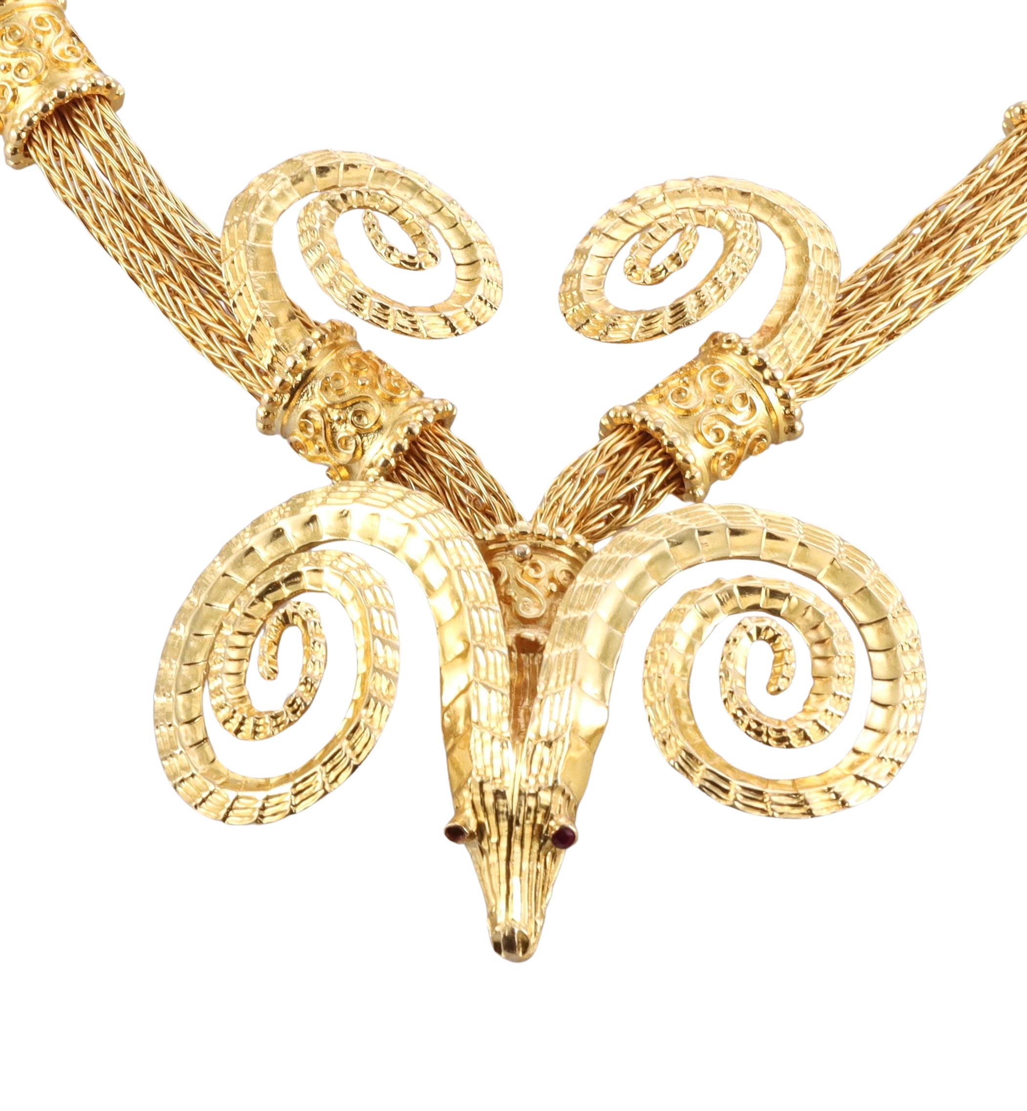 18k yellow gold necklace, by the most prominent Greek designer Ilias Lalaounis, featuring iconic design -  ram's heads. The necklace is 18