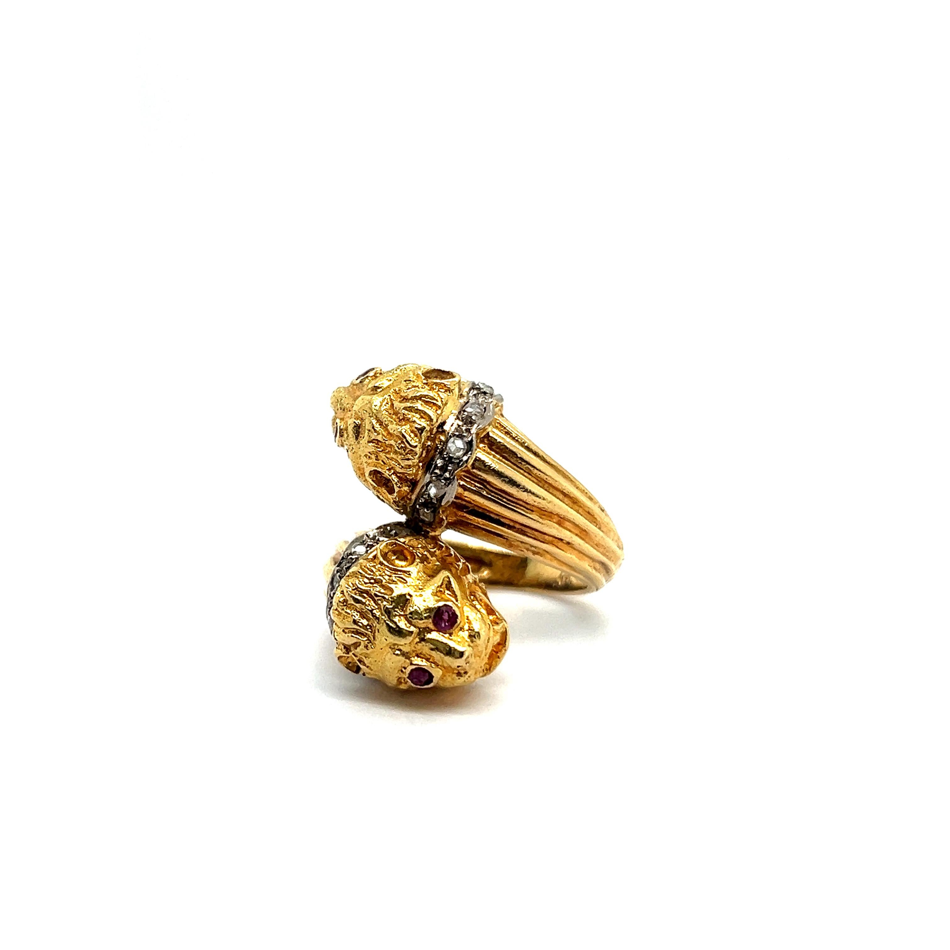 Elevate your style with the Vintage Lalaounis Ruby Diamond Two-Headed Lion Ring, an emblem of bravery from the esteemed Greek jewelry house founded by Ilias Lalaounis in 1940. 

Crafted in 18 Karat yellow gold, it features four rubies and ten