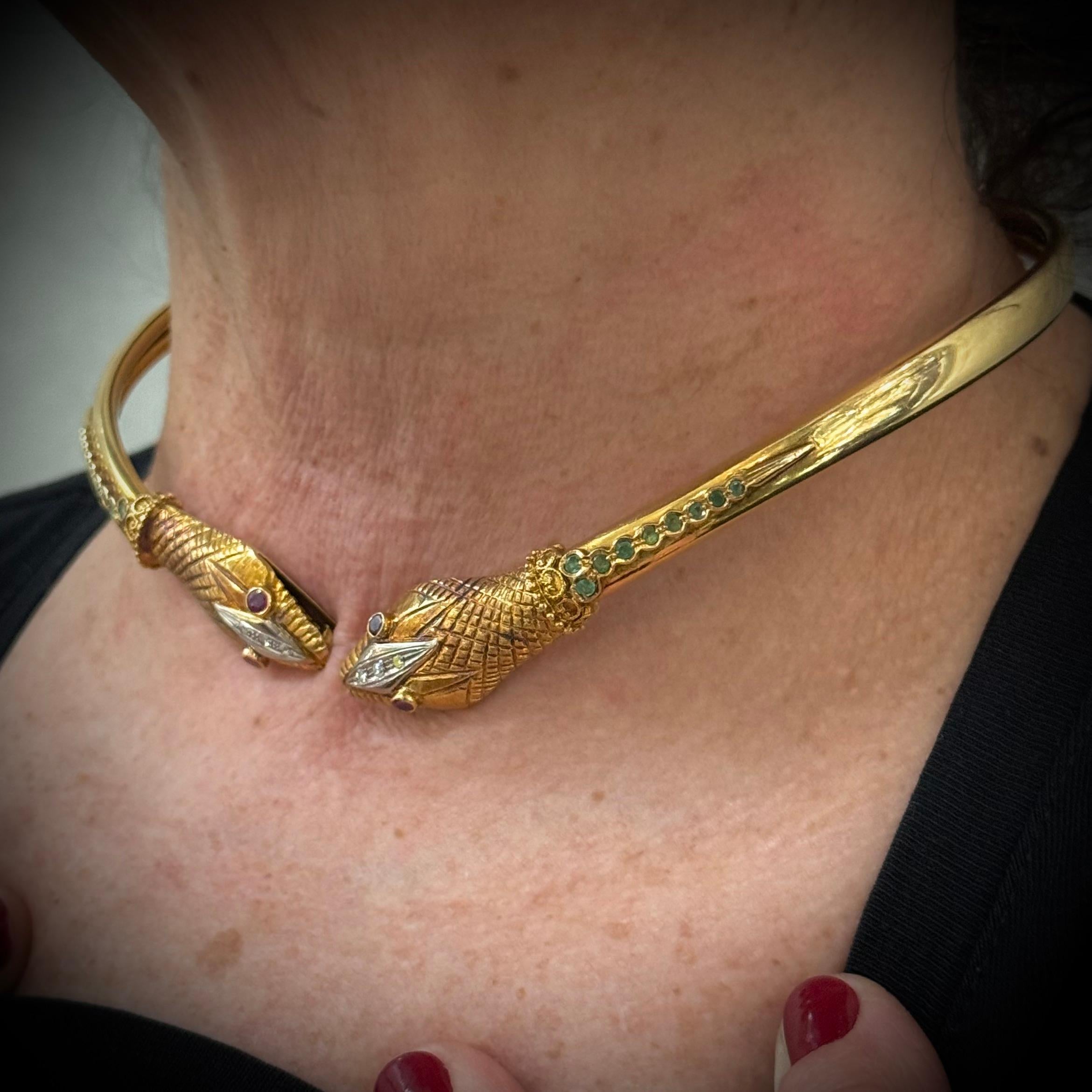 LALAoUNIS Vintage Snake Torque Necklace in 18K Rose Gold with Rubies, Emeralds, and Diamonds, Greece, 1980s/1990s.

An iconic design by Greek master jeweler Ilias Lalaounis, this vintage torque necklace takes the form of a stylized double-headed
