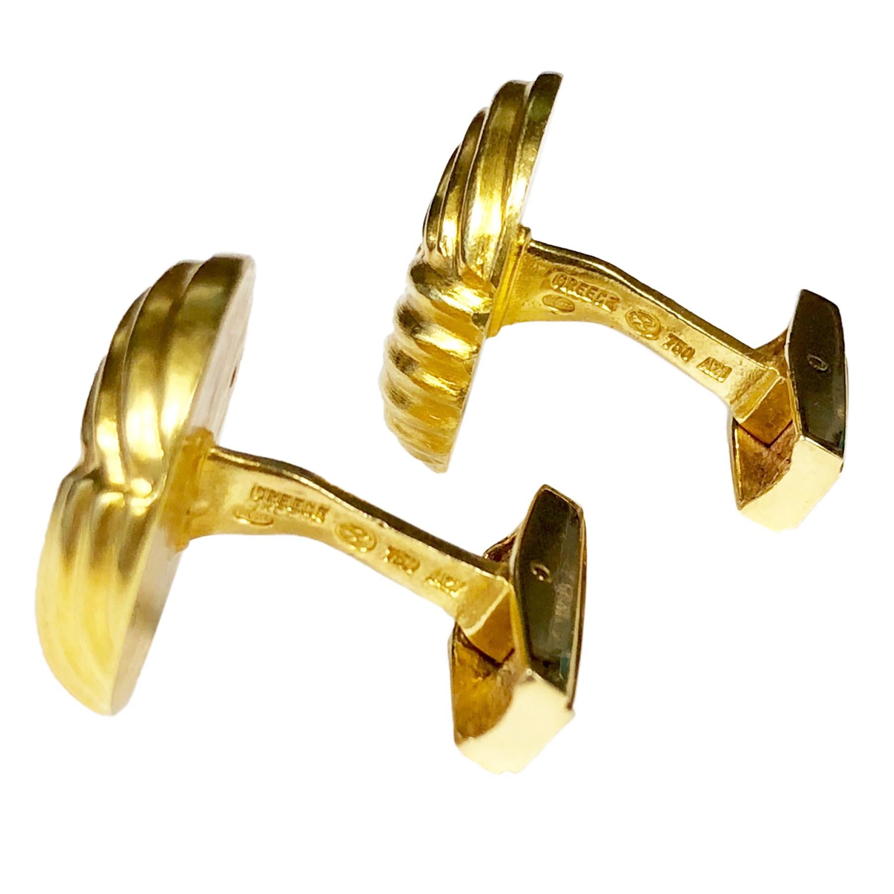 Circa 2000 18K Yellow Gold Cufflinks by Ilias Lalaounis Greece, having a deep grooved design the tops measure 3/4 inch in diameter, having toggle backs for easy on and off. These come in the original Lalaounis Gift box.