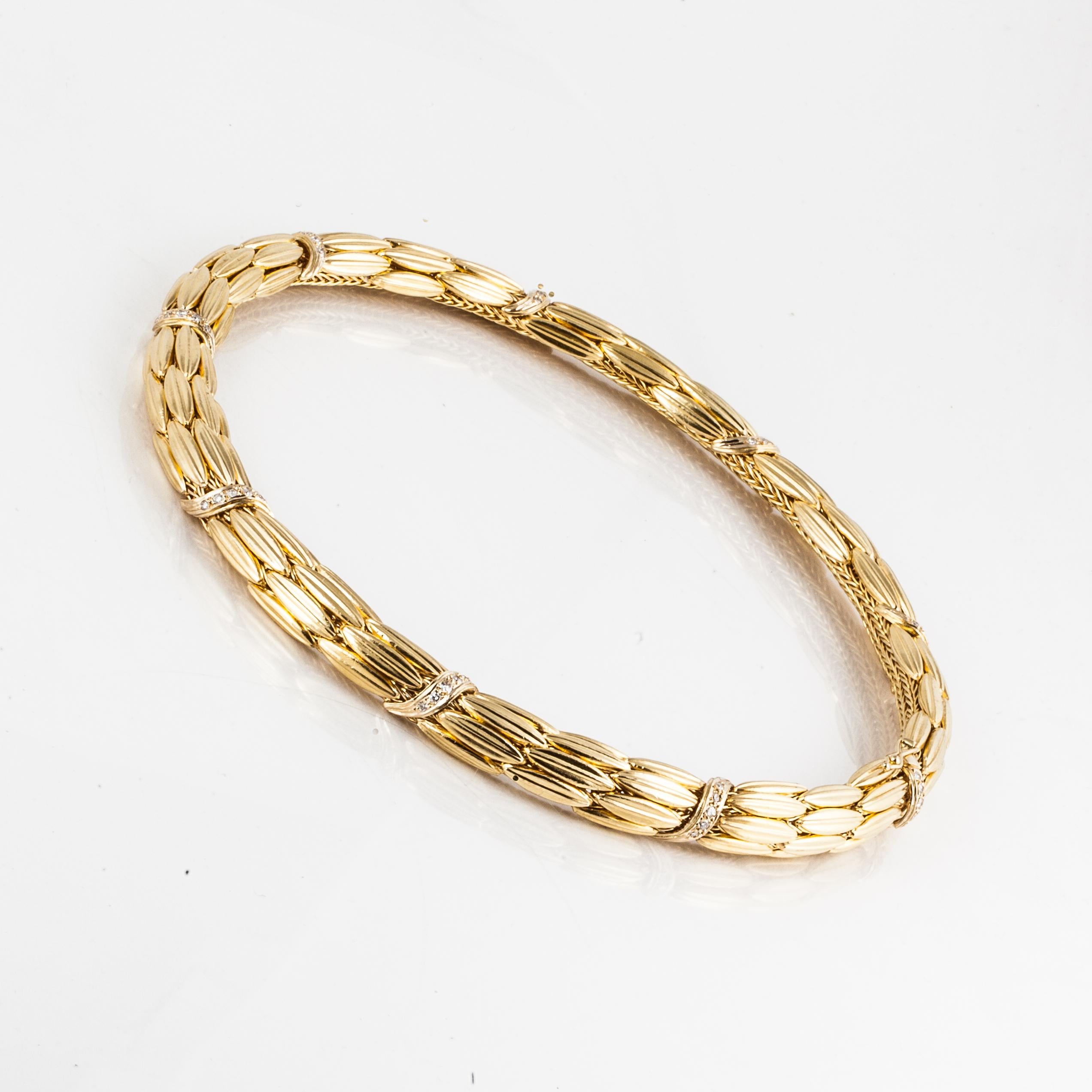 Lalaounis wheat pattern collar style necklace accented with diamonds in 18K yellow gold.  There are forty-five diamonds that total 0.90 carats.  The necklace measures 16 inches long and 3/8 inches wide.