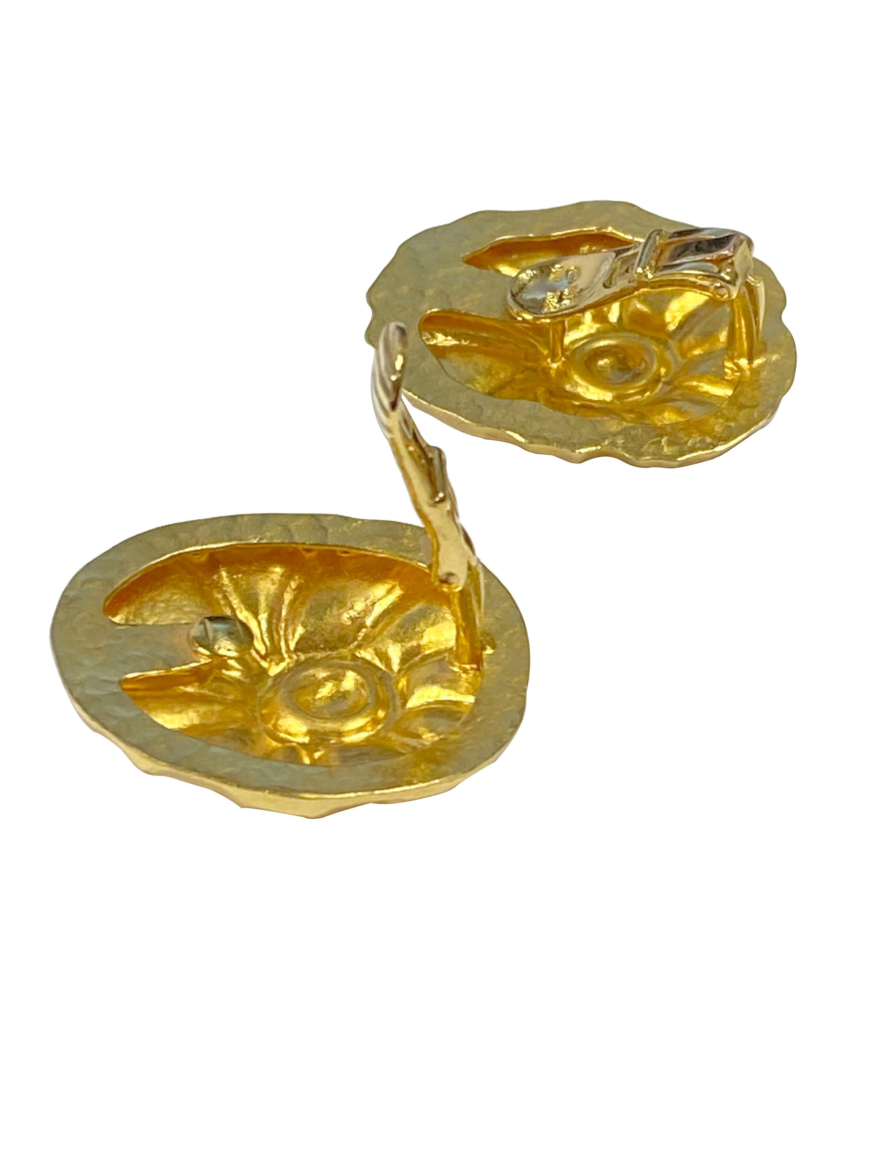 Circa 1990 Ilias Lalaounis 18k Yellow Gold Earrings, measuring 1 1/8 X 1 inch and weighing 16.7 Grams, having a hand hammered finish with a Nautical Ocean design. Having clip backs to which a post can be easily added if desired. 