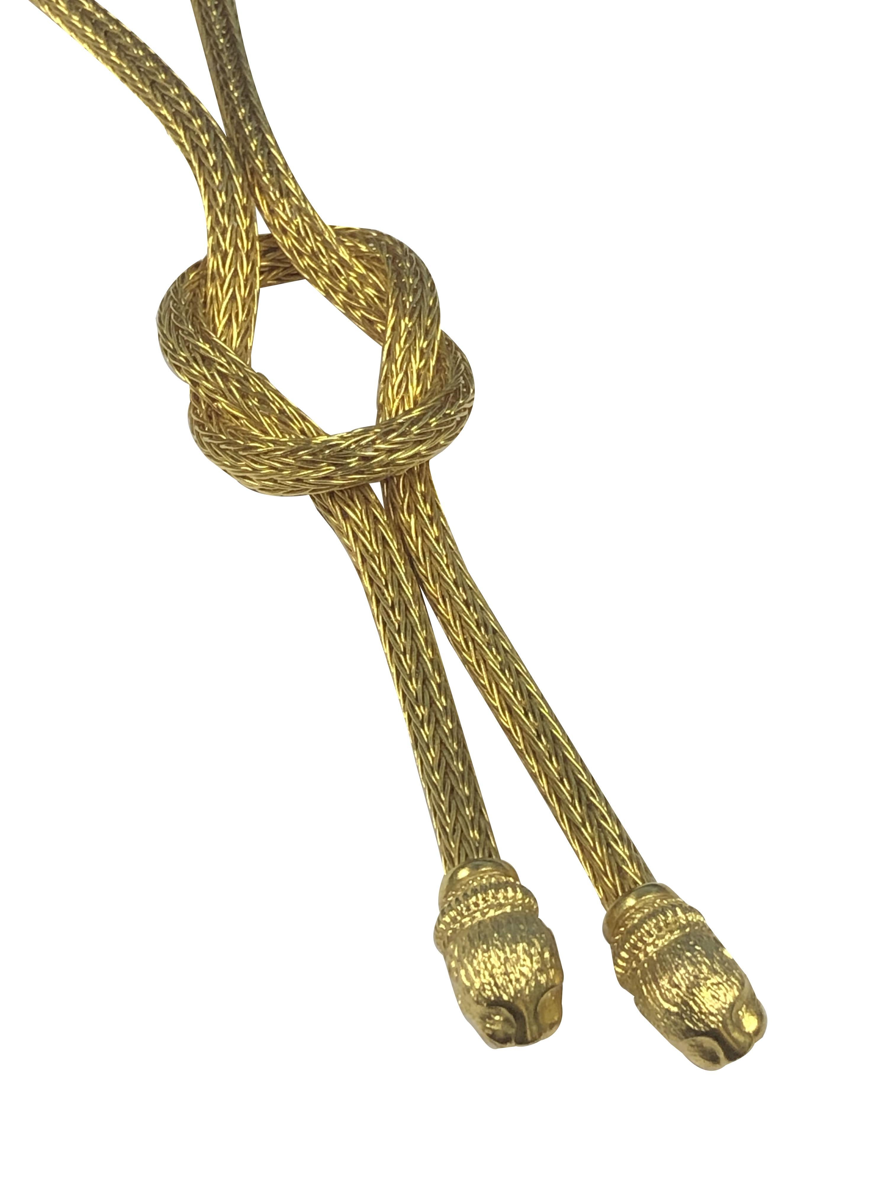 Circa 2000 Ilias Lalaounis of Greece 18K Yellow Gold Chimera Lariat Necklace, measuring 24 inches in length with the Round woven chain being 3/16 inch in Diameter and  the piece weighing a total of 65 Grams. The Chimera Head end pieces are nicely