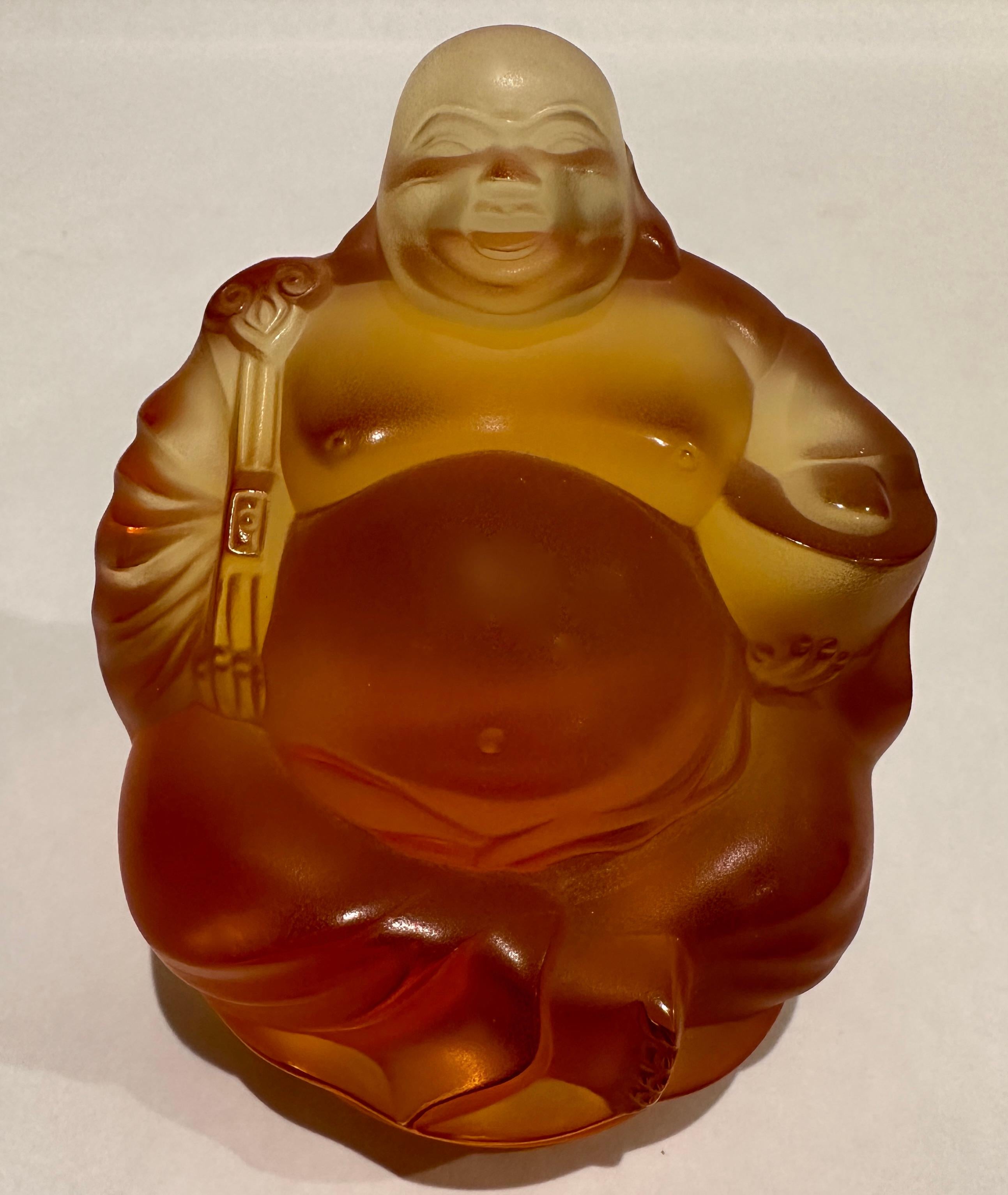 A Lalique limited edition amber glass model of a seated 'Happy Buddha', numbered 809/888.