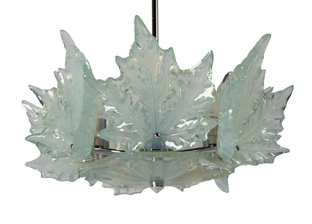 A Marc Lalique “Champs Élysées” chandelier, chromed metal, opalescent glass. Incised signature Lalique, France.
As there are many “Champs Élysées” in clear and frosted crystal, this one is the only one in opalescent crystal that we know.
Measures: