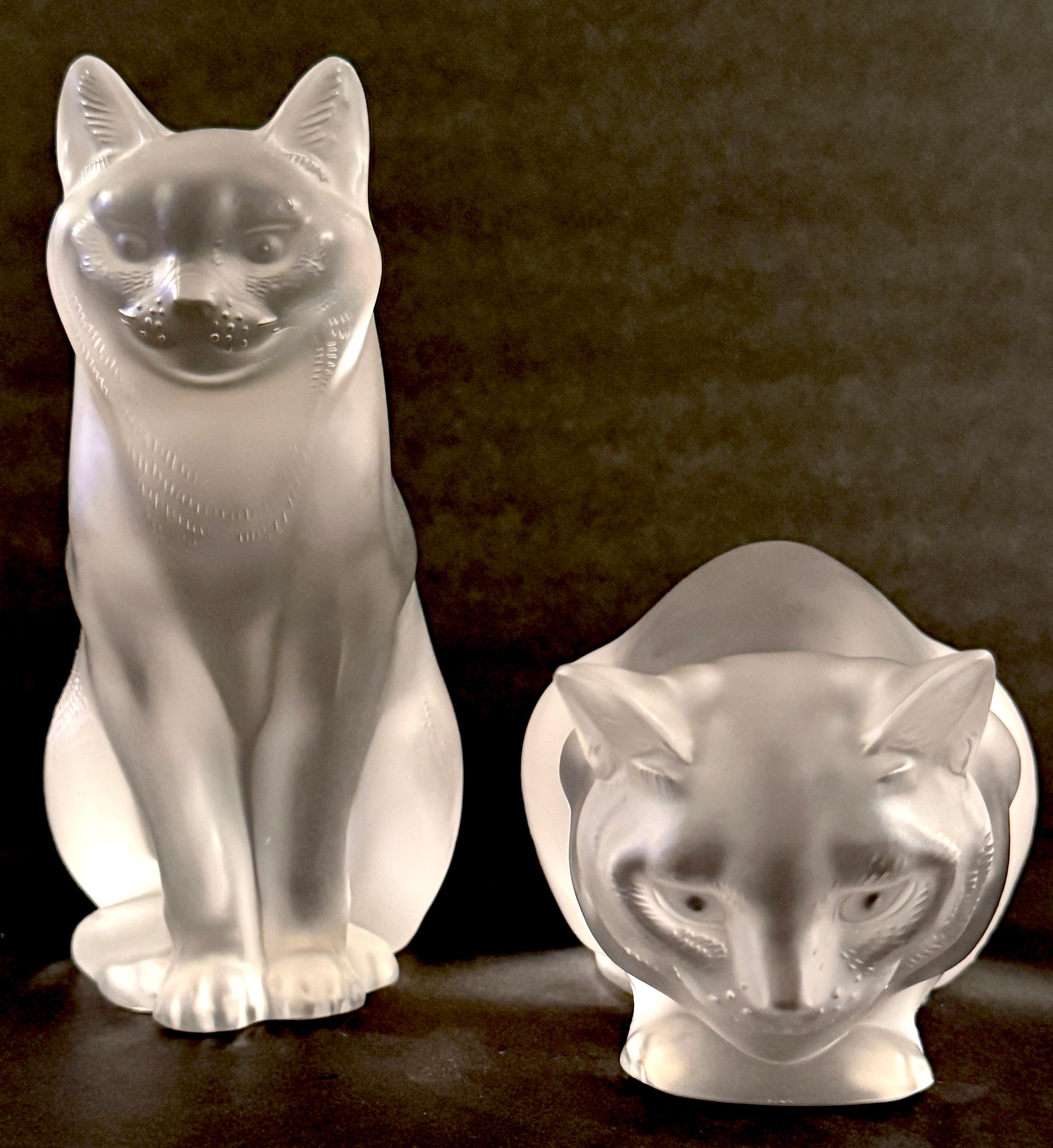 Lalique Chat Couche #11602 & Chat Assis #11603, A Pair 

France, 1970s, Provenance: Lalique Gallery Palm Beach, FL 

A rare and hard-to-find pair of Lalique crystal cats, Chat Couche #11602 and Chat Assis #11603, made in France in the 1970s. These