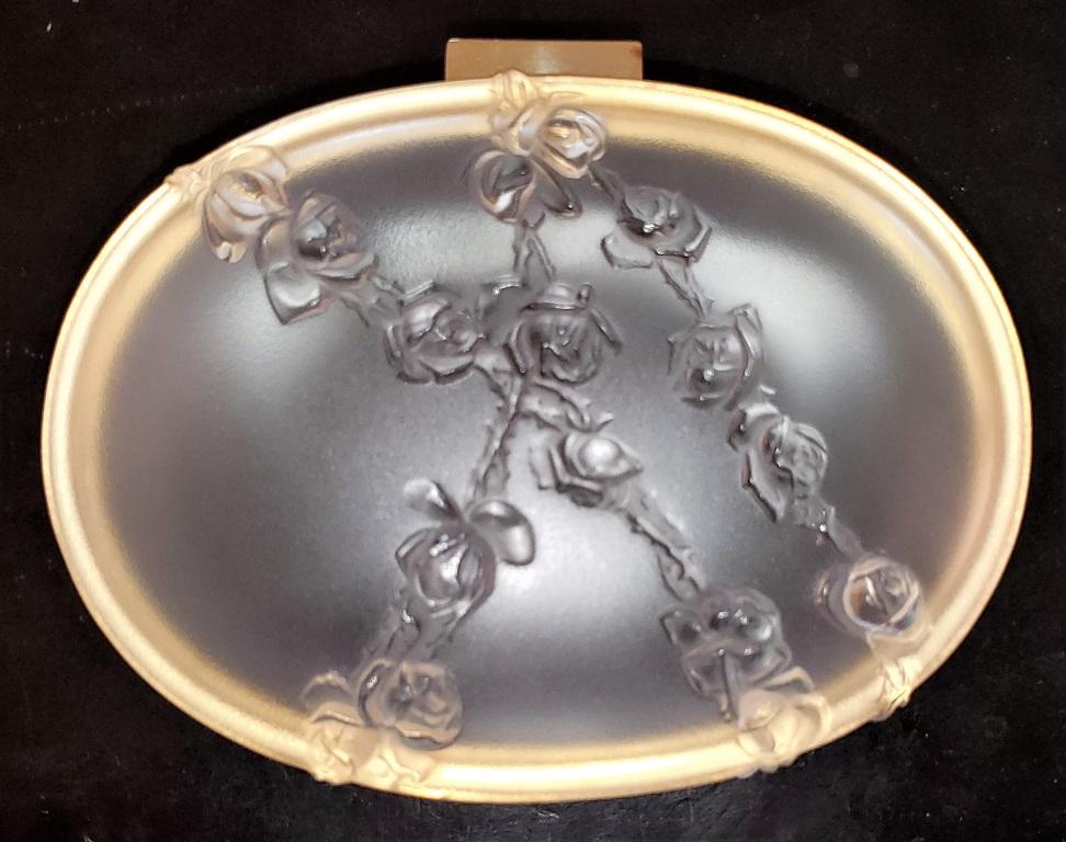 Presenting a beautiful Lalique coppellia jewelry box.

Made by Lalique – France circa 1960.

This is a Classic Lalique piece with opalescent glass with embellished roses on gold plated mounts.

Fully signed and in excellent condition.

A
