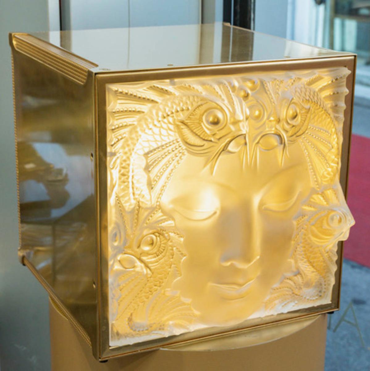 The “Masque de Femme” motif created by René Lalique in 1935 to adorn the fountain on the Champs Elysées. 
It has since been used again and again in numerous creations, including ...
Pressed white molded crystal 
Signed at the tip 
Decorative panel