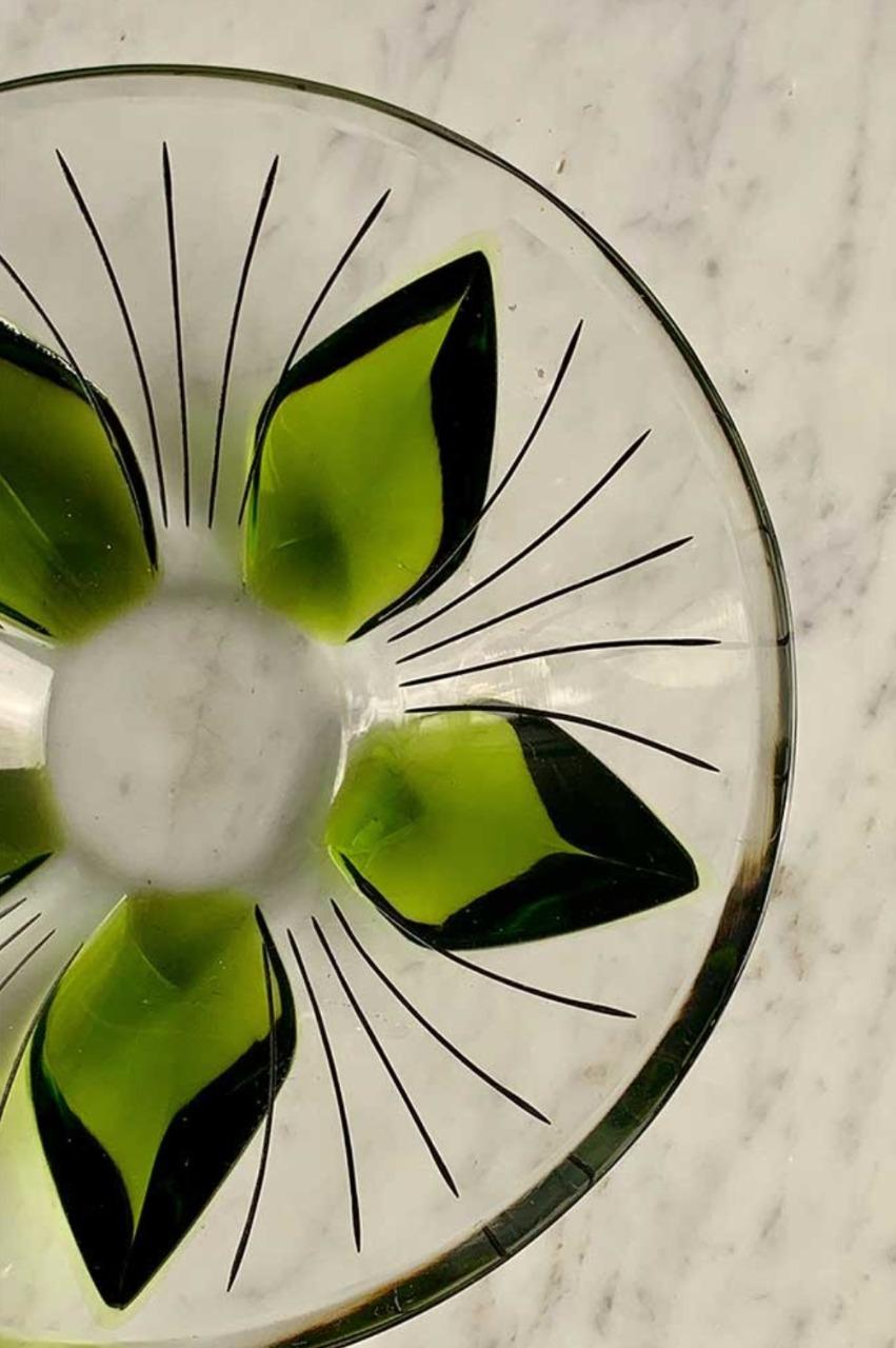 Product information
Lalique crystal bowl featuring green colored lotus leaves surrounded by arching black stripes. Signed 