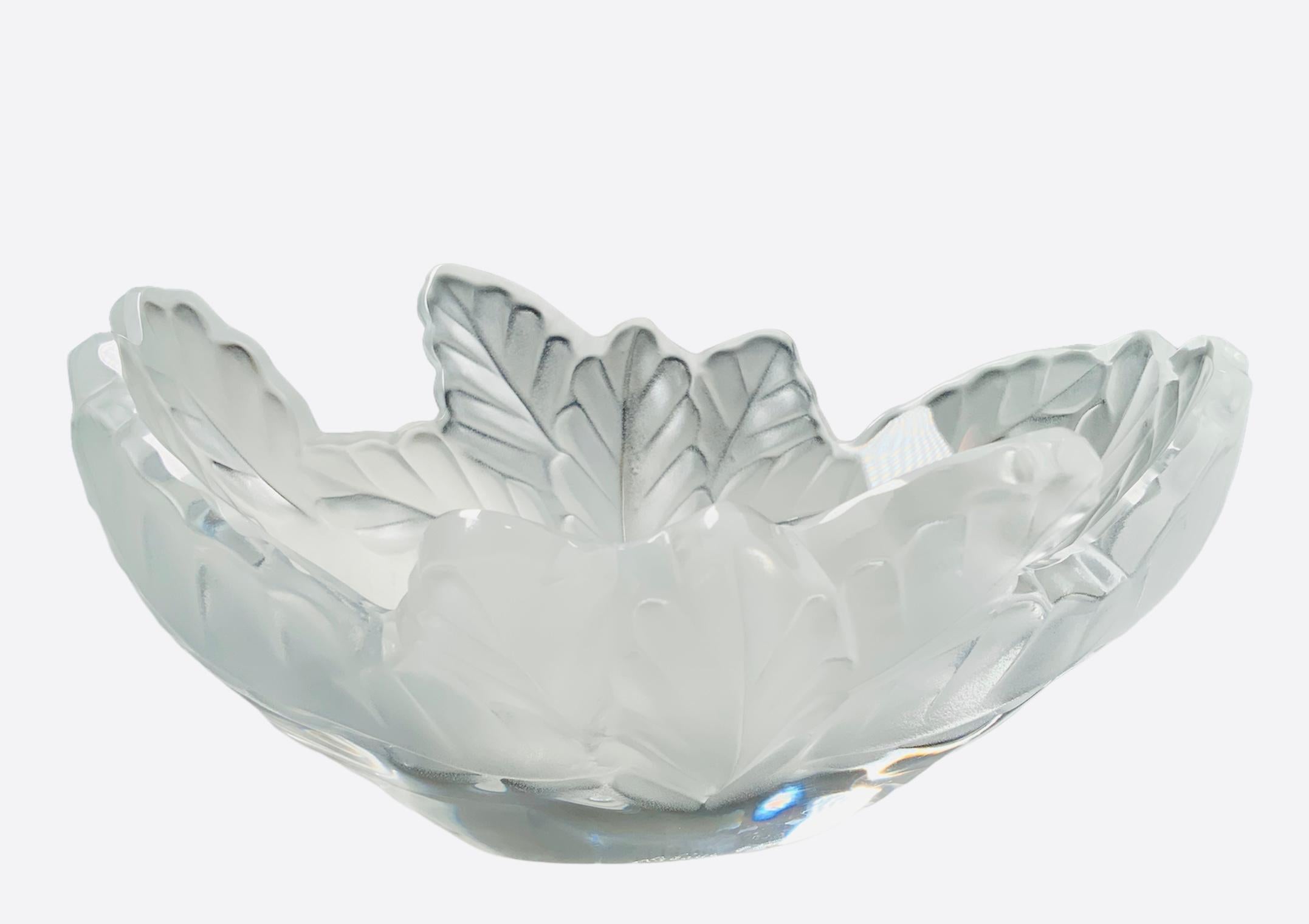This is a Lalique Crystal Compiegne small size oval jardiniere bowl. The bowl crystal is clear and frosted. It depicts multiple oak leaves arranged around a circular center base. Below the base, it is the acid etched Lalique circle R, France