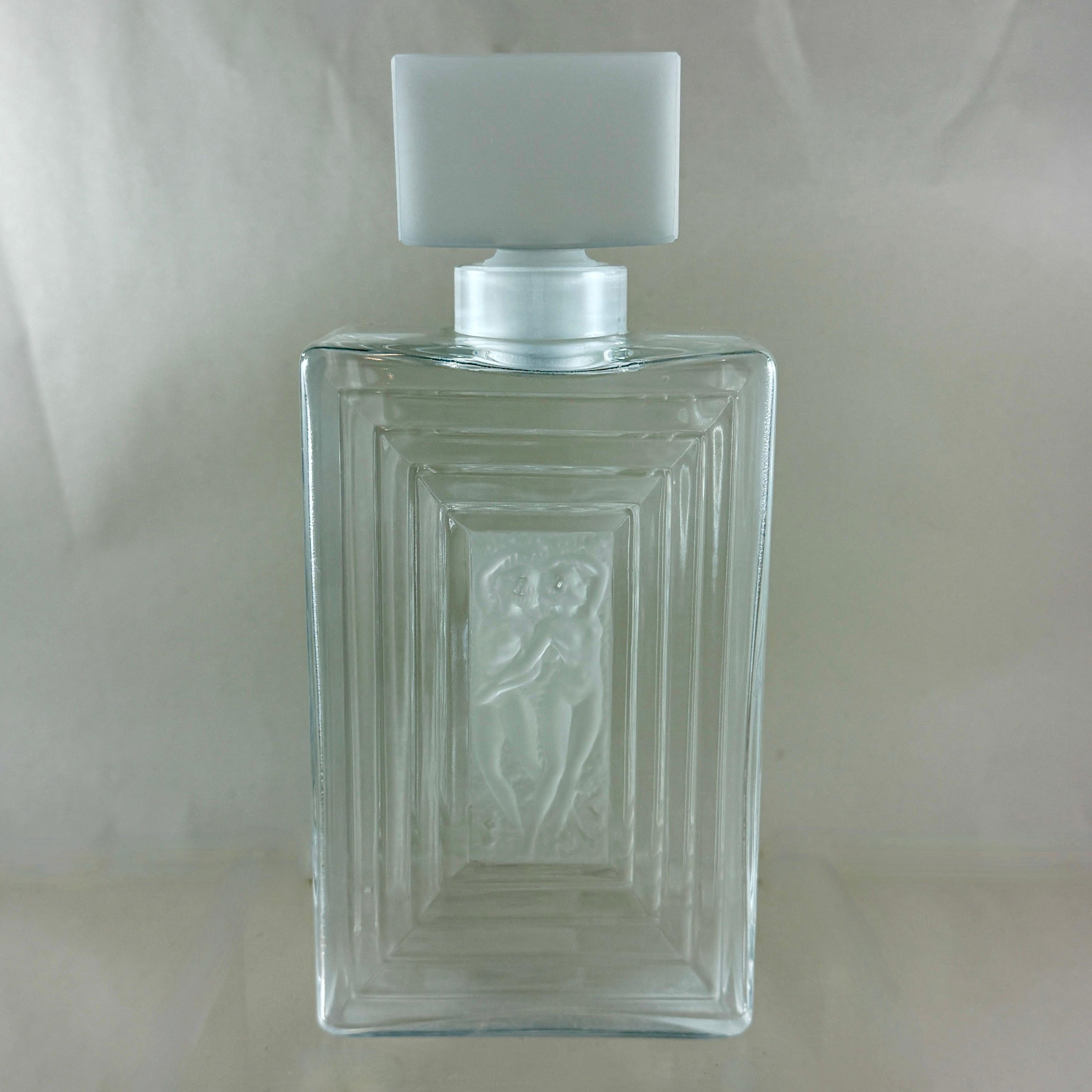 From Lalique Crystal, an oversized ‘Duncan No. 3’ Perfume Bottle, circa 1980s.

The Duncan Line by René Lalique was designed in 1931. The pattern was inspired by the American dancer Isadora Duncan and her portrayal of ancient Greek figures. 
In the