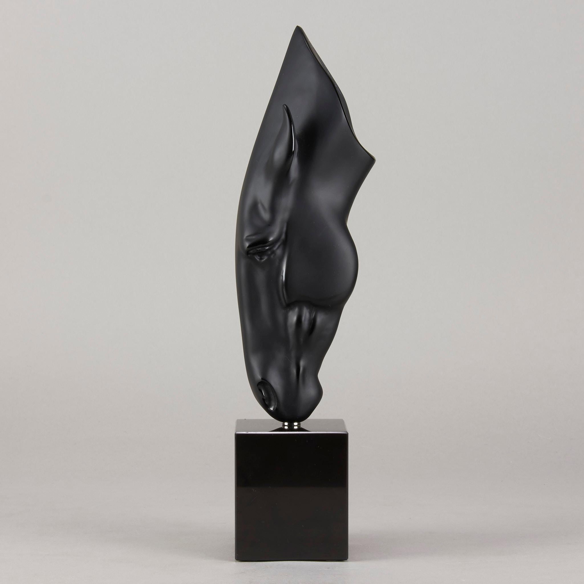 An outstanding deep black crytal glass study of a horse gently drinking from a water's surface, raised on a polished black glass plinth, signed Lalique France and numbered from the limited edition 40/250.
Lalique has produced the first