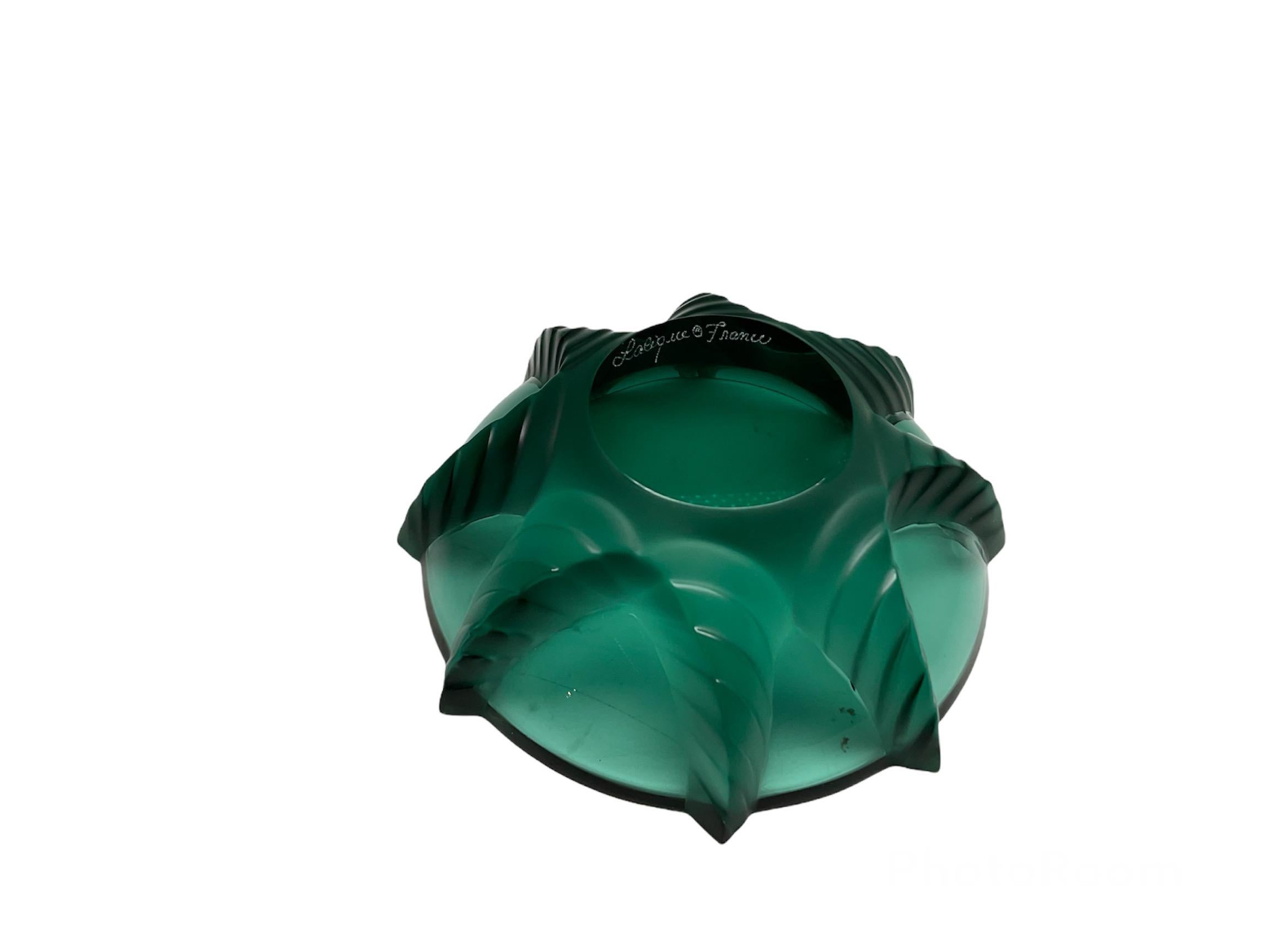 This is a Lalique Crystal green teal sea star small bowl. The engraved large sea star wraps up the bowl.