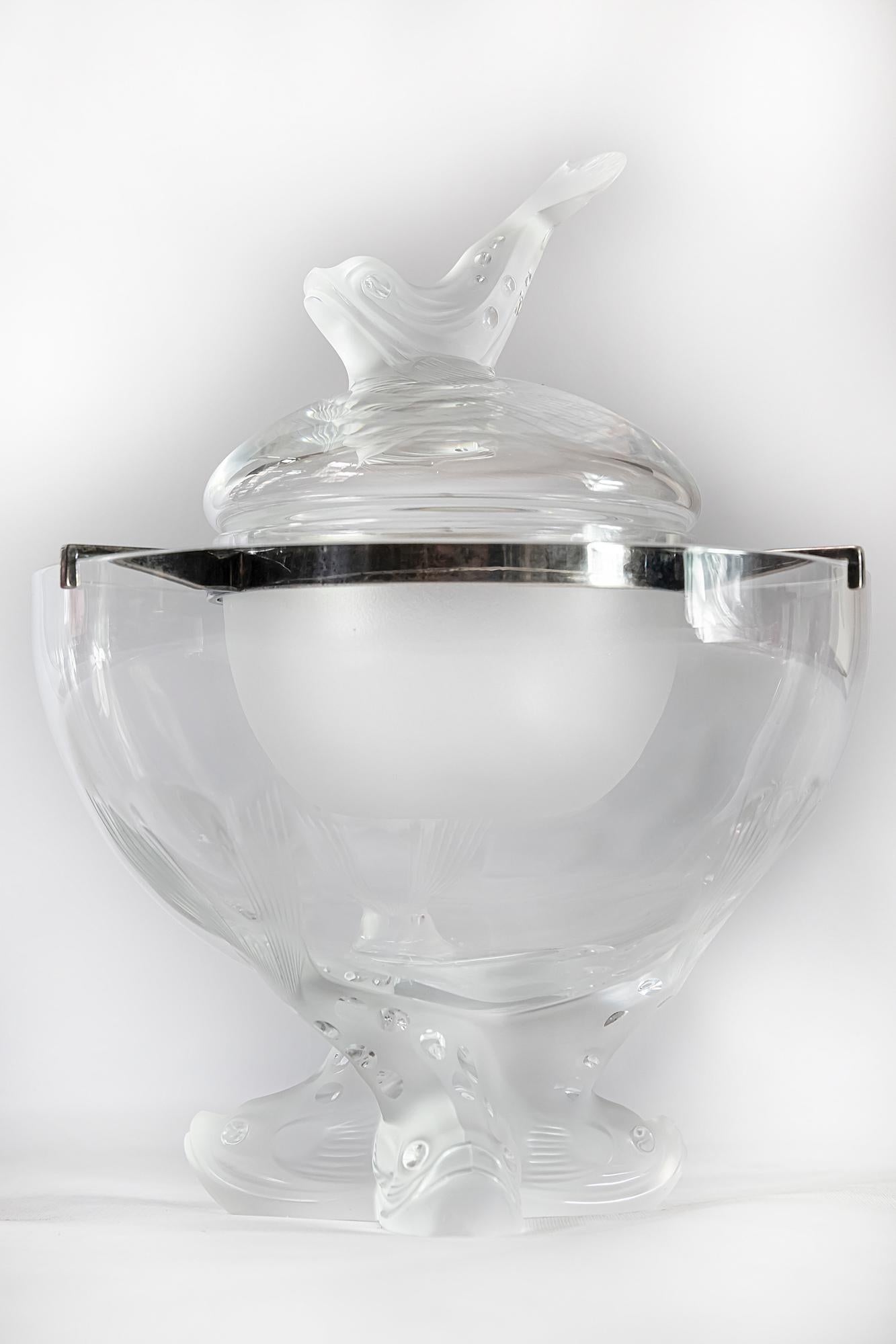 French Lalique crystal Ingor caviar serving bowl set consists of four items.
The bowl is decorated with matte surface fish motives, engraved elements.
Signed both on main and small bowls.