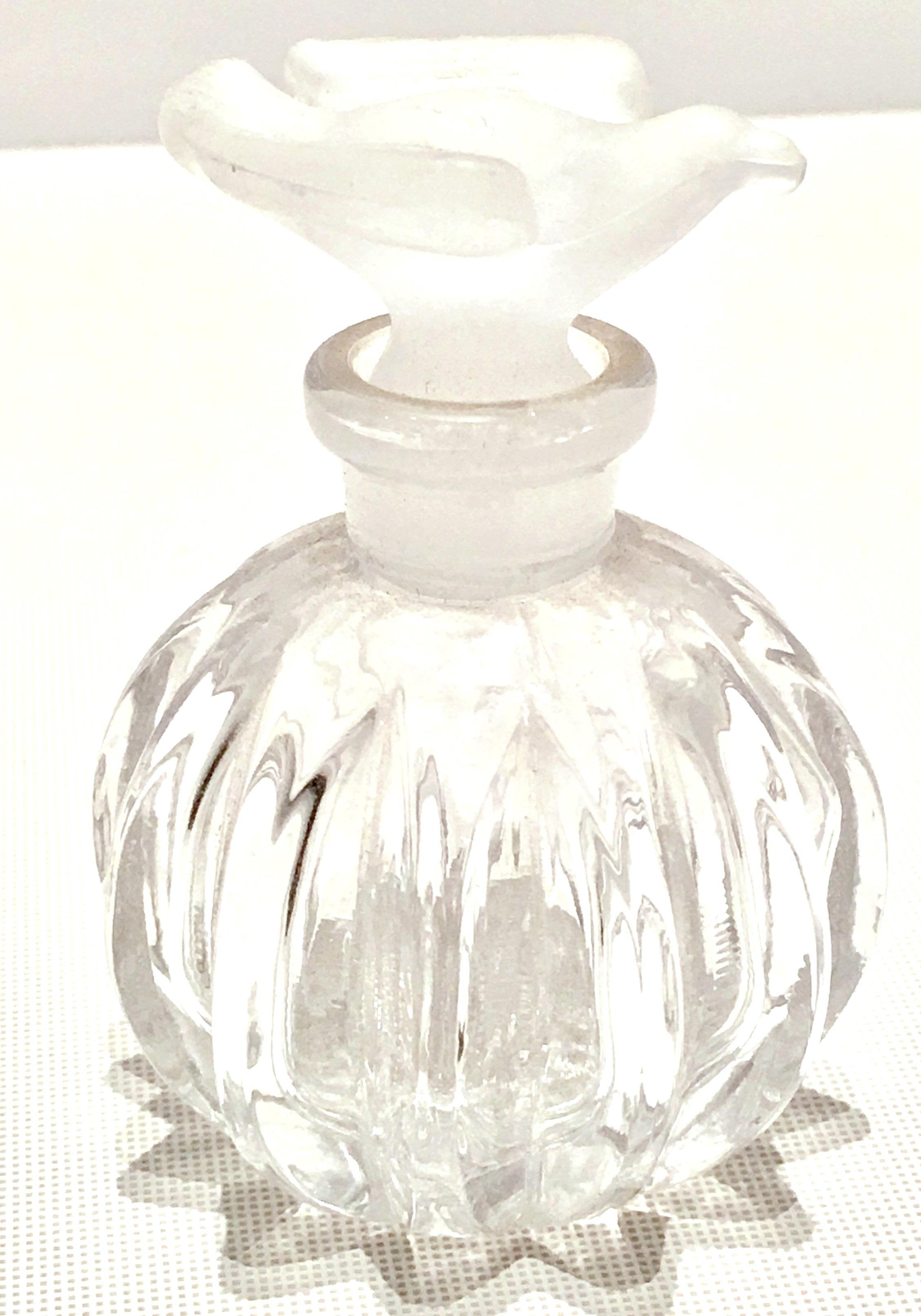 Vintage Iconic Lalique crystal perfume decanter for Nina Ricci L'Air du Temps perfume. Features an optic crystal clear cut body and frosted dove motif stopper.