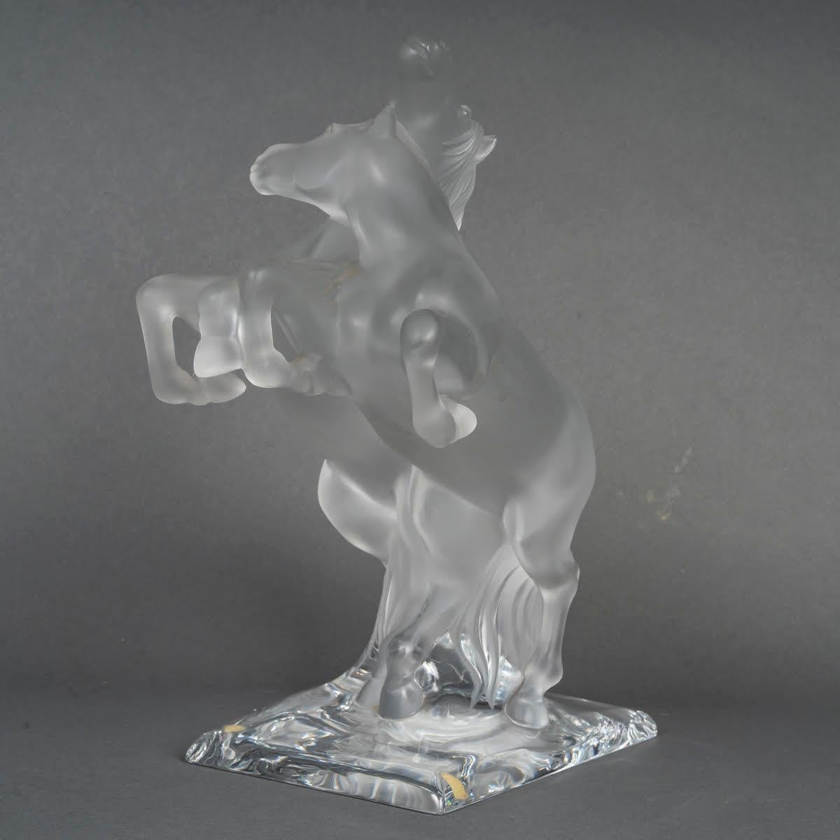 Lalique crystal sculpture of 2 horses, 20th century.

A Lalique crystal sculpture of 2 horses, 20th century.
H: 35cm, W: 18cm, D: 27cm 