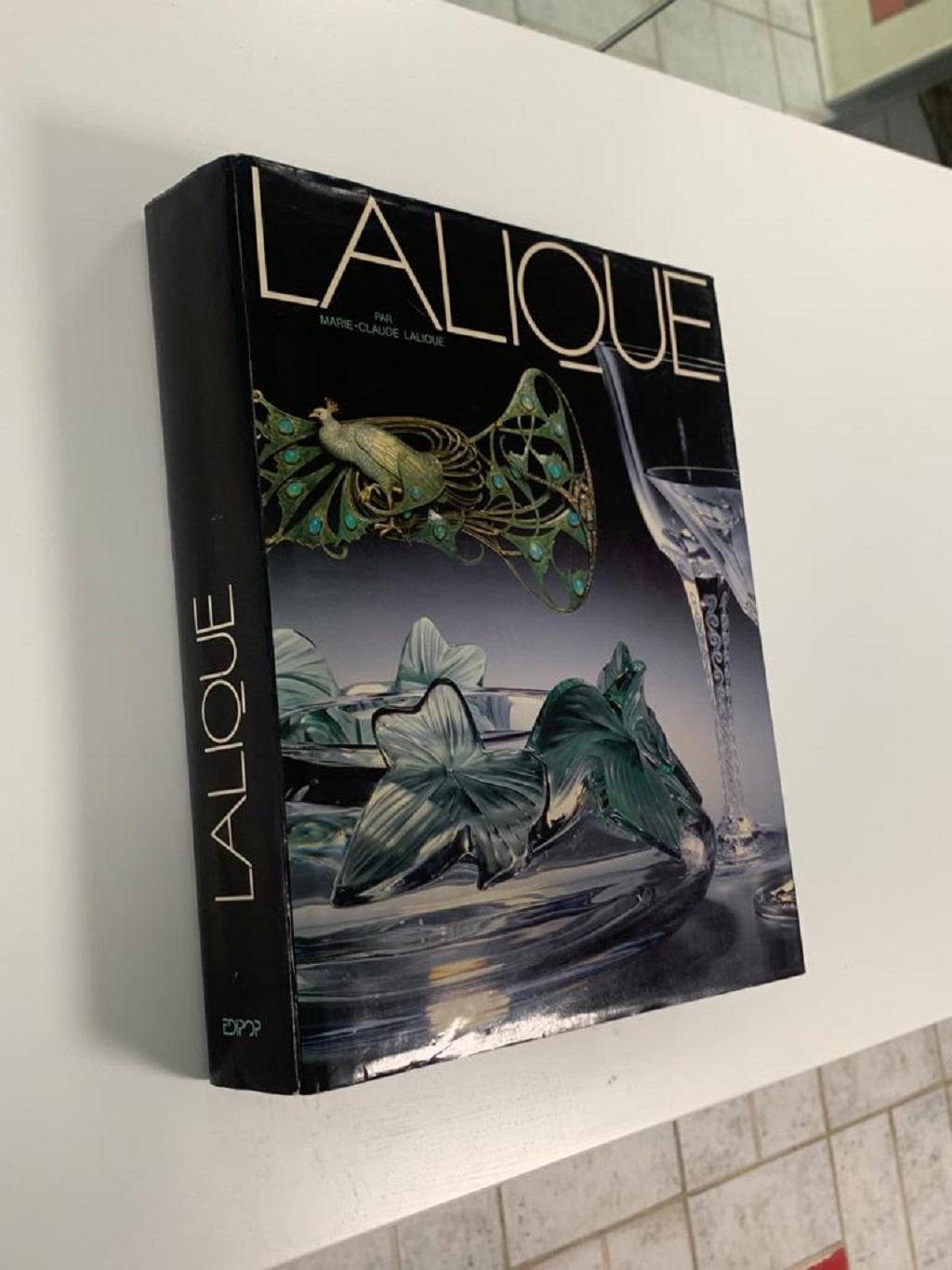 First edition, published by Edipop, 1988. Text in French. 
A beautiful publication covering the fine works of French glass designers Lalique. The book takes us through the history of the company from its beginnings under Réne Lalique and his