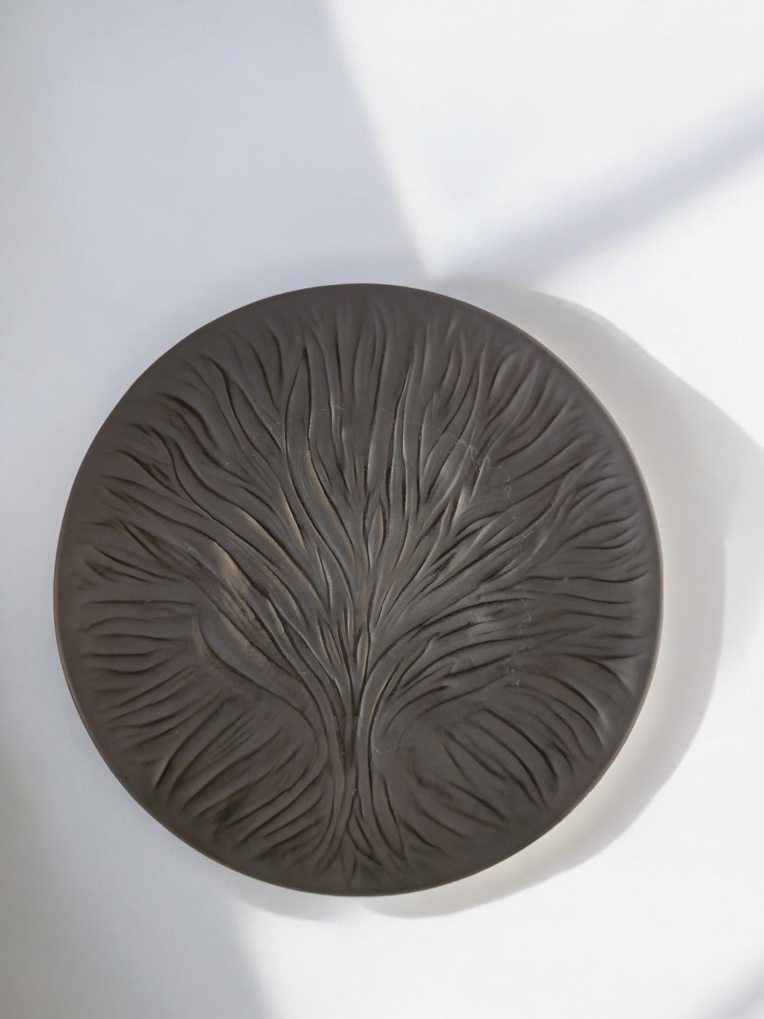 Lalique France black crystal ‘Algues’ plate featuring the iconic Tree of Life motif, rendered in a rare and dramatic matte black finish. Expertly crafted in France by the renowned crystal house Lalique, this sculptural plate showcases a flowing