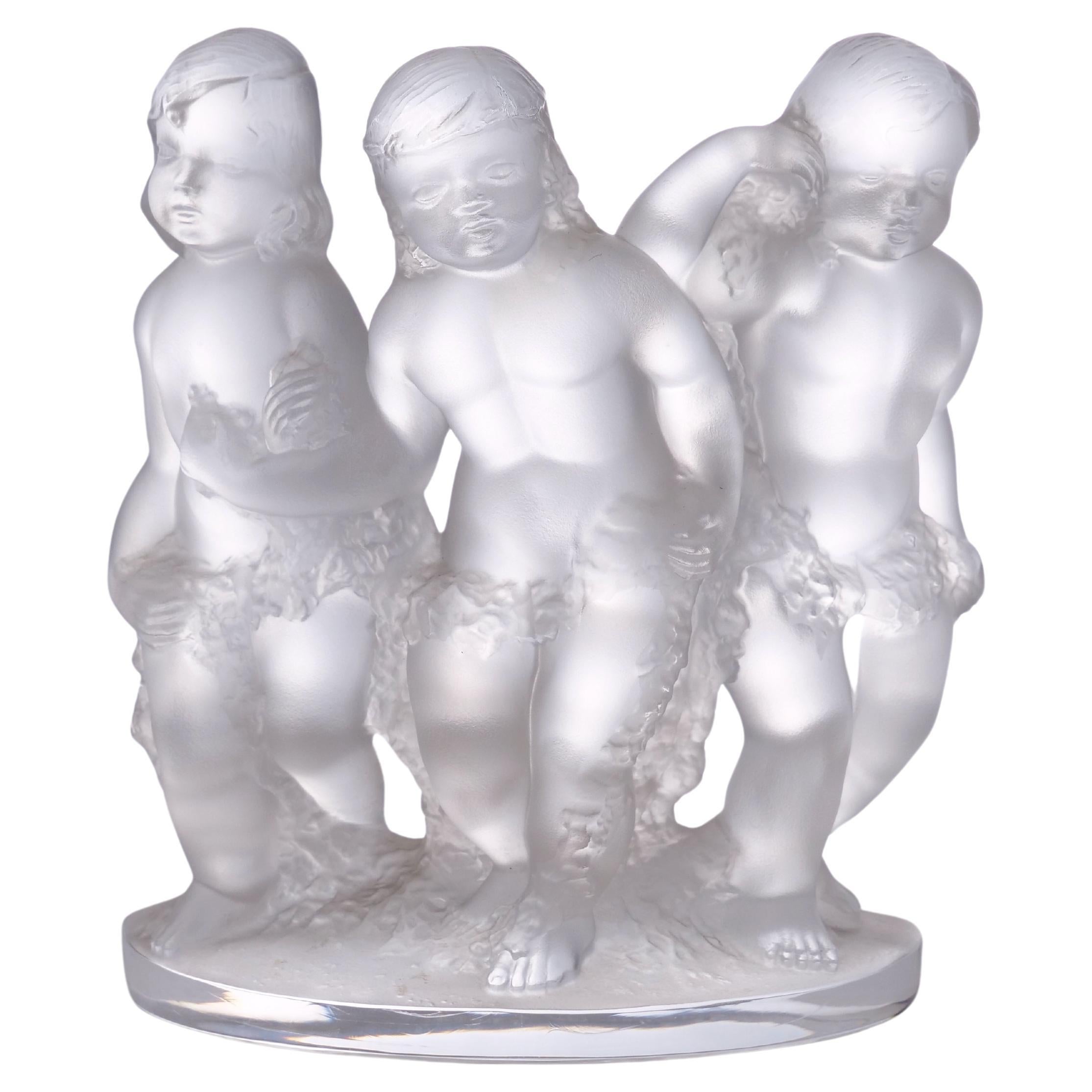 Lalique France frosted crystal two trio set figural cherub group decorative centerpiece or bookends. Each one is in great condition. Minor wear consistent with age / use. Maker's mark undersigned. Each trio of cherub measures 7.75 inches high X 6.3