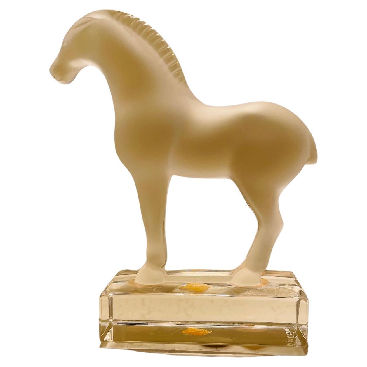 This is a Lalique frosted and clear crystal “Tang” Horse sculpture /figurine. The powerful horse is standing up straight with strong muscles, well groomed mane and tail. Below the rectangular clear crystal base is the acid etched Lalique hallmark.