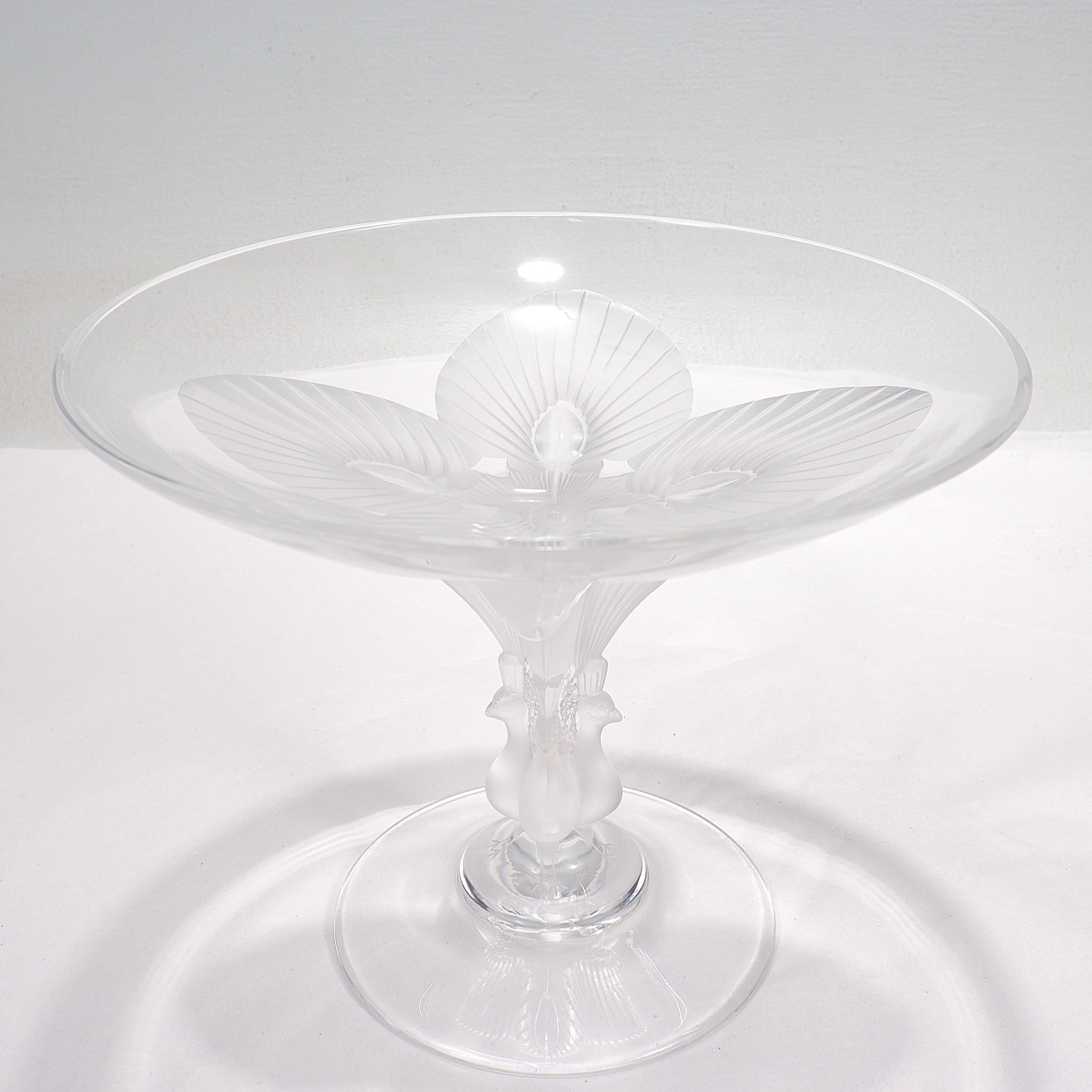 A fine French art glass compote.

By Lalique.

With frosted peacocks to the pedestal that terminates in a frosted flower to the bottom of the bowl.

Simply a wonderful piece from the world's premier art glass house!

Date:
20th