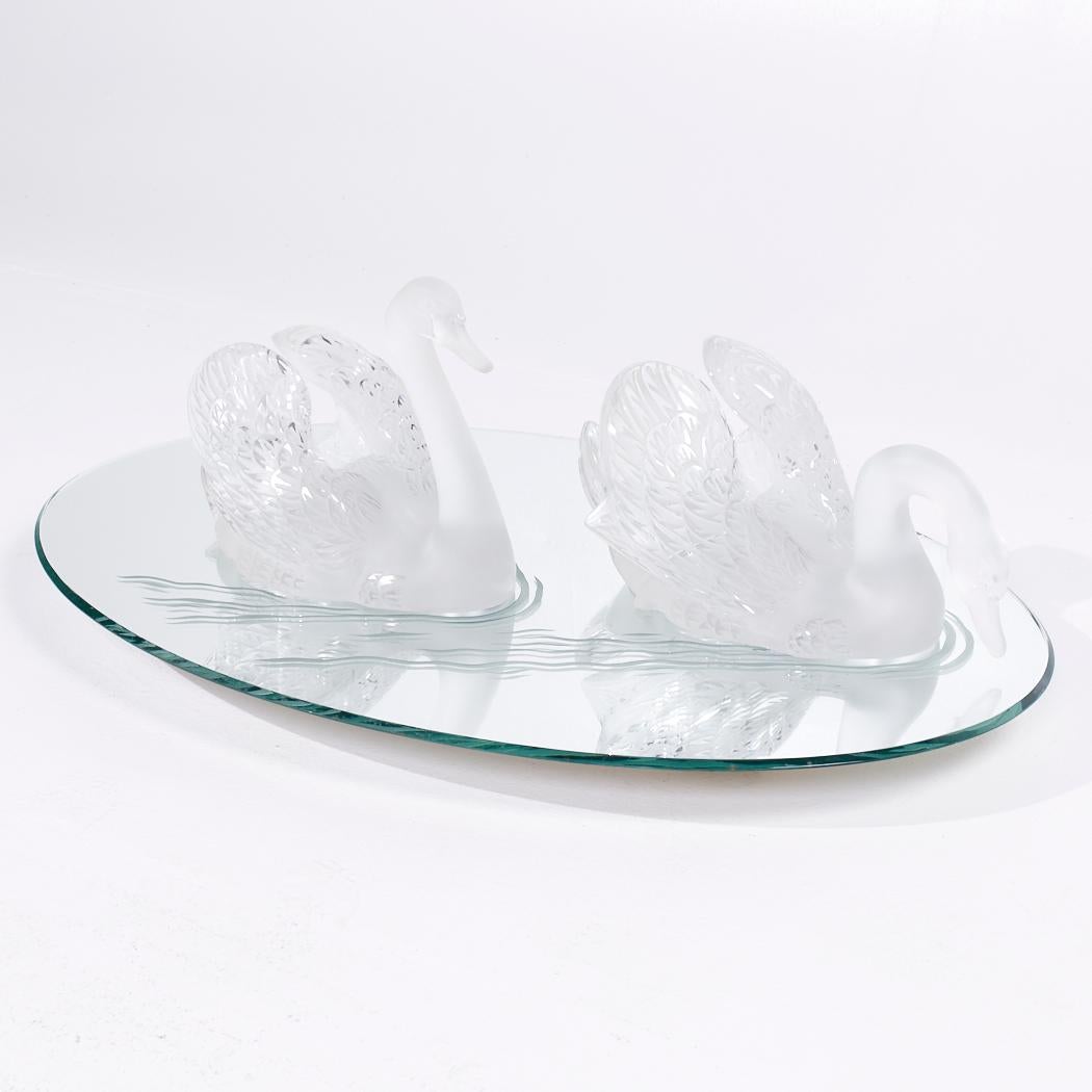 Lalique Frosted Crystal Swimming Swans Pair with Mirror

This crystal set measures: 33 wide x 22.25 deep x 10 high

We take our photos in a controlled lighting studio to show as much detail as possible. We do not photoshop out blemishes. 

We keep
