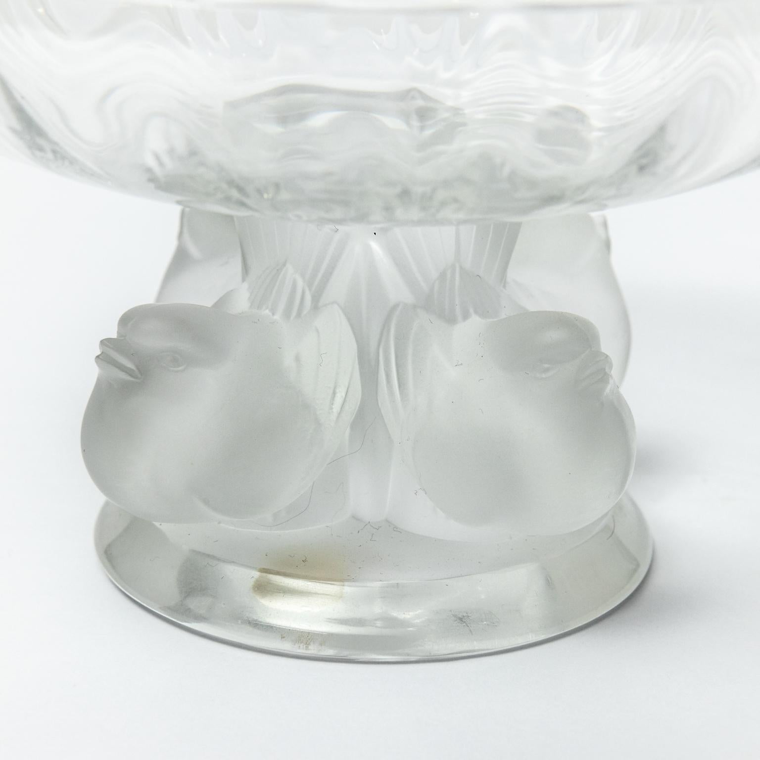 Circa 20th century glass nogent bowl designed by Marc Lalique in 1966. This small bowl has become a Lalique classic. The satin finish on the birds contrast with the transparency of the bowl and the purity of the crystal. Made in France. Please note