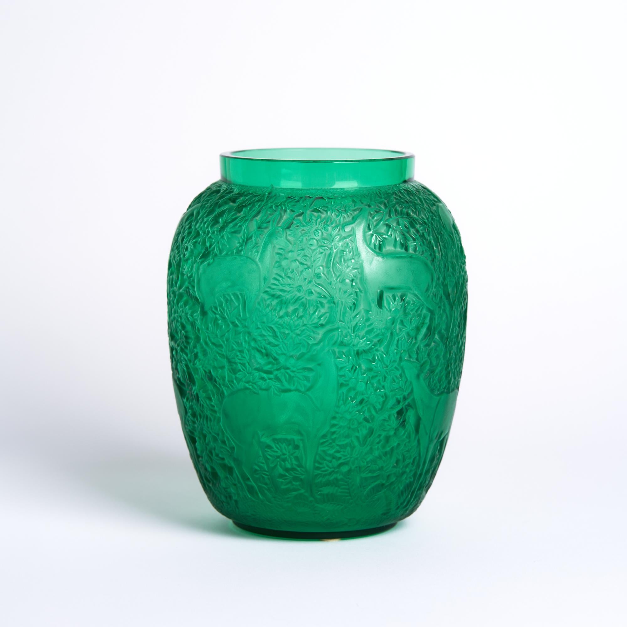 Lalique green glass biches vase

This vase measures: 5.5 wide x 5.5 deep x 6.75 inches high 

This vase is in Great Vintage Condition

We take our photos in a controlled lighting studio to show as much detail as possible. We do not photoshop