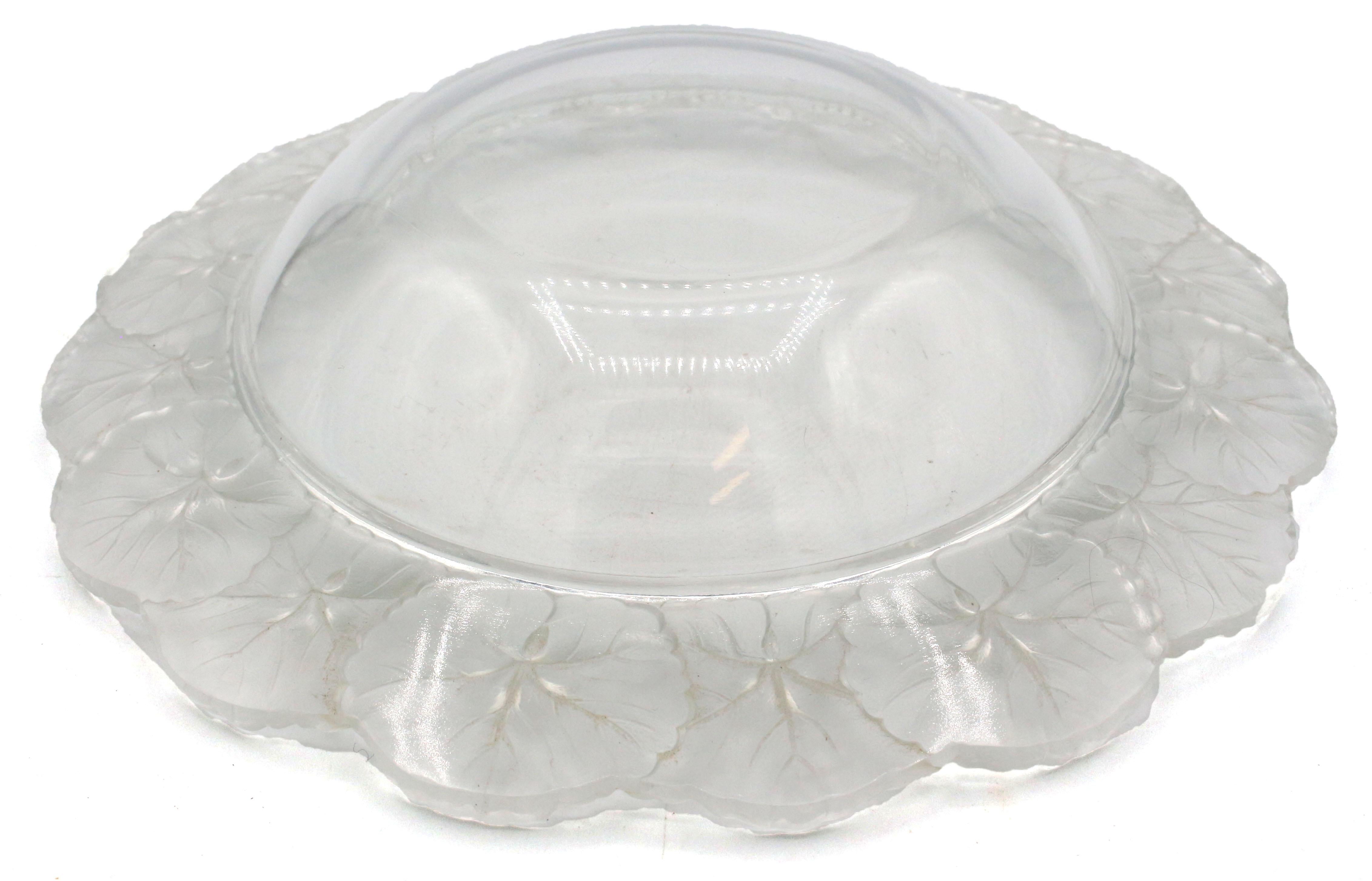 Lalique Honfleur crystal bowl, France, mid-20th century. The geranium border rim in frosted glass to clear glass central bowl.
10.75