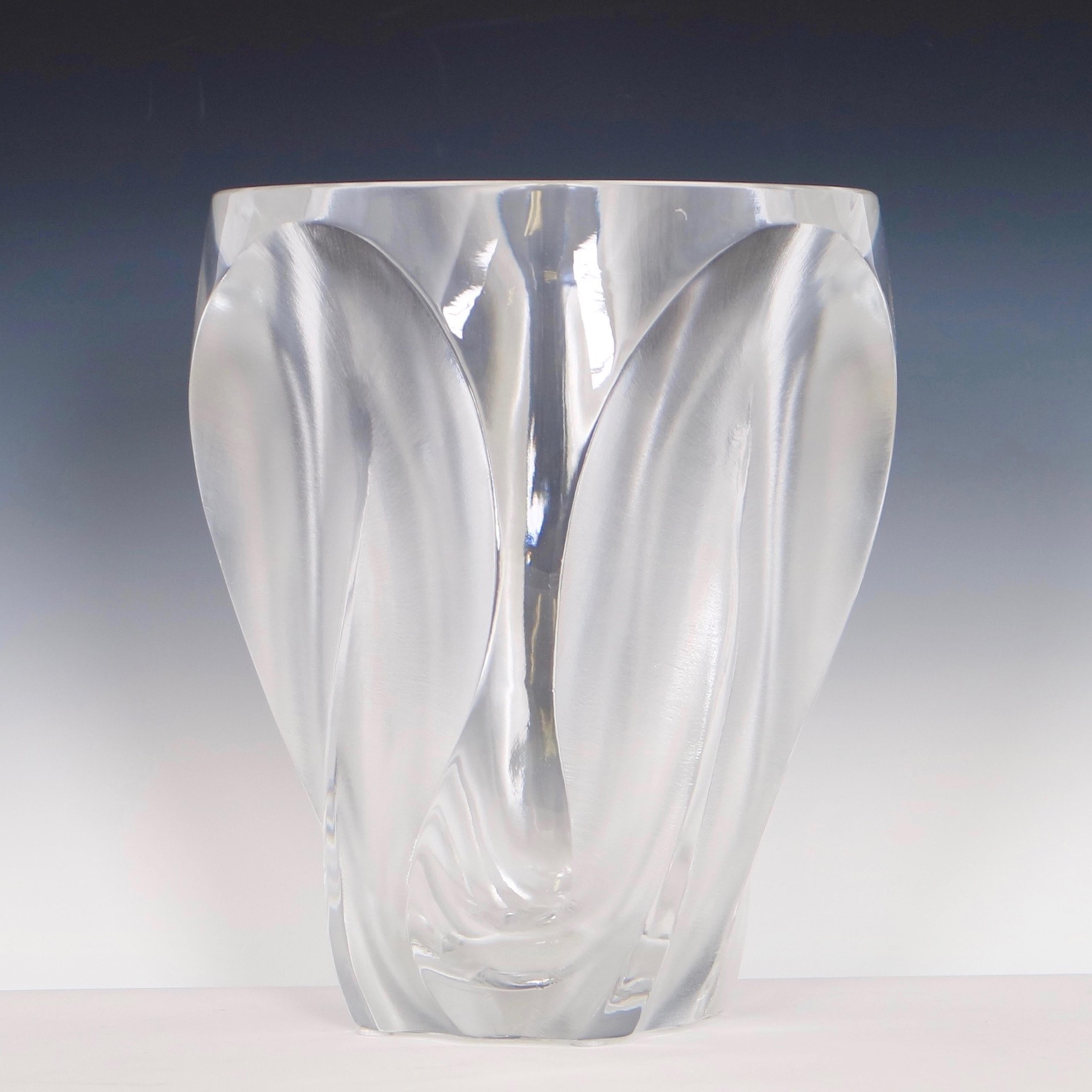 Lalique Ingrid vase designed by Marc Lalique, circa 1964. Crafted in a mix of satin and clear crystal glass the piece features petal like cut outs on four sides. The vase includes the signature Lalique France. Wear appropriate to age and use. The