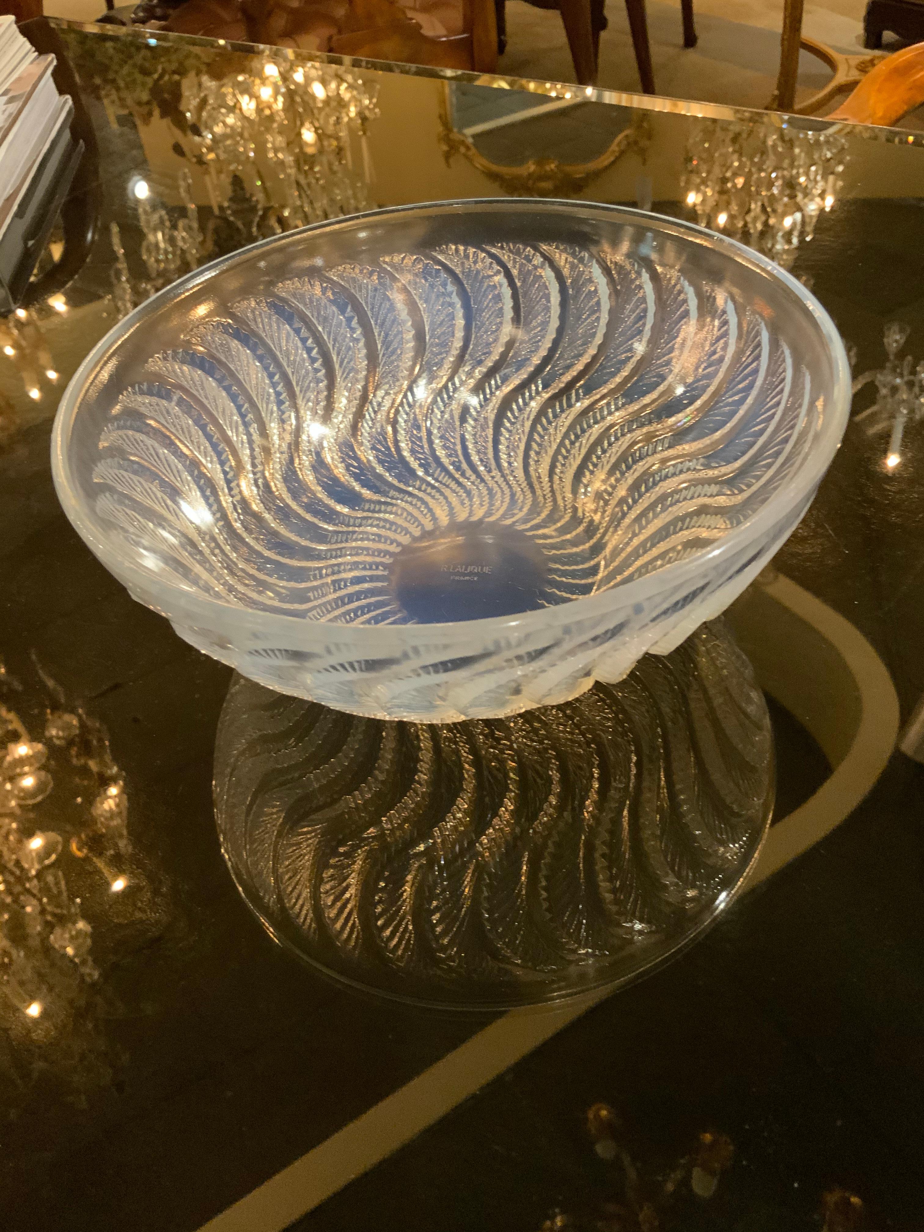 R Lalique bowl with an iridescent glow in a pale blue hue
Exquisite design and quality.