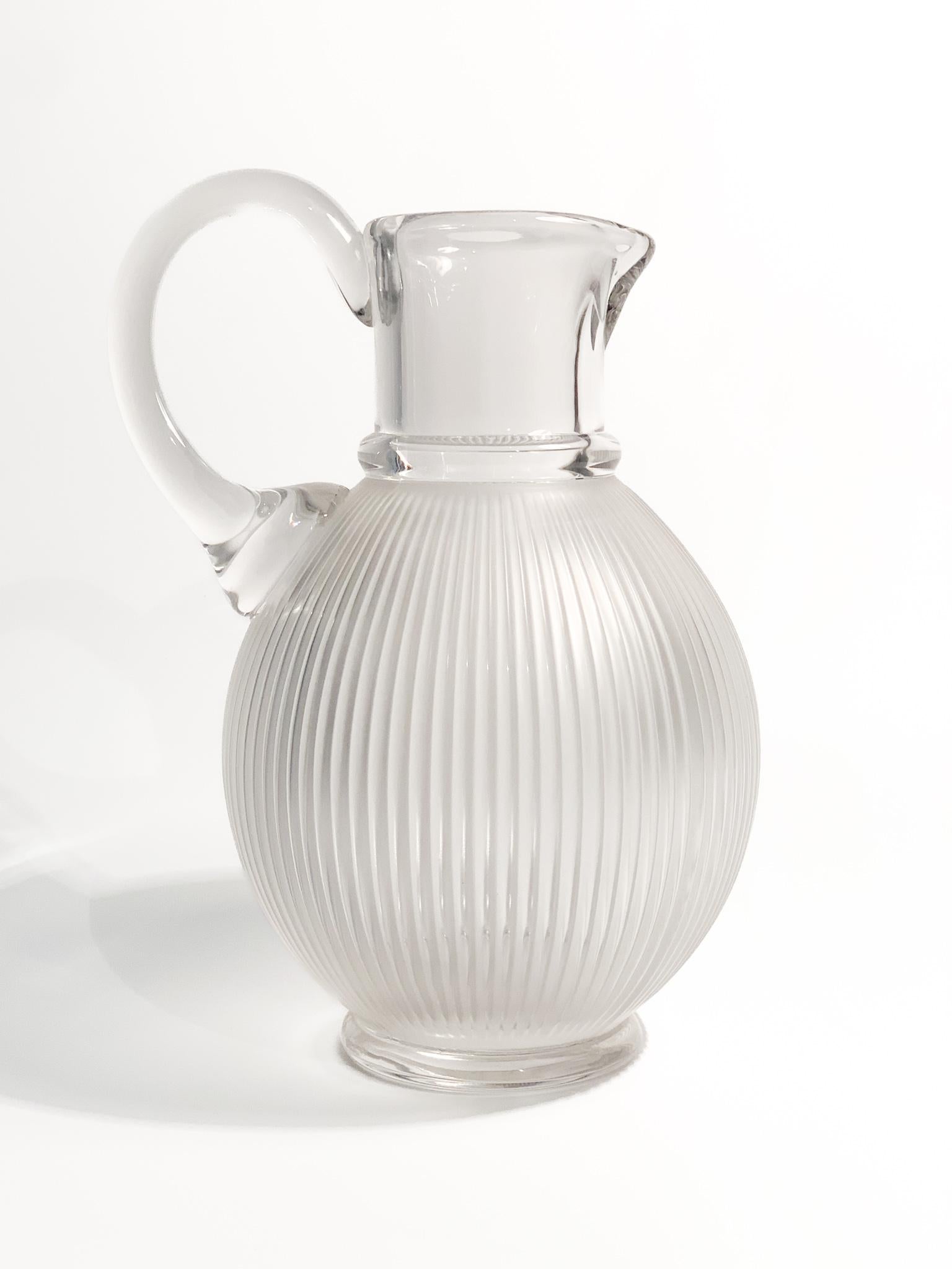 Lalique Langeais Crystal Pitcher / Carafe.

Ø 16 cm h 22 cm

The Langeais collection was designed by Renè's son Marc Lalique in 1976, and has become an iconic model. The lines, inspired by ancient columns and the most modern architecture, are