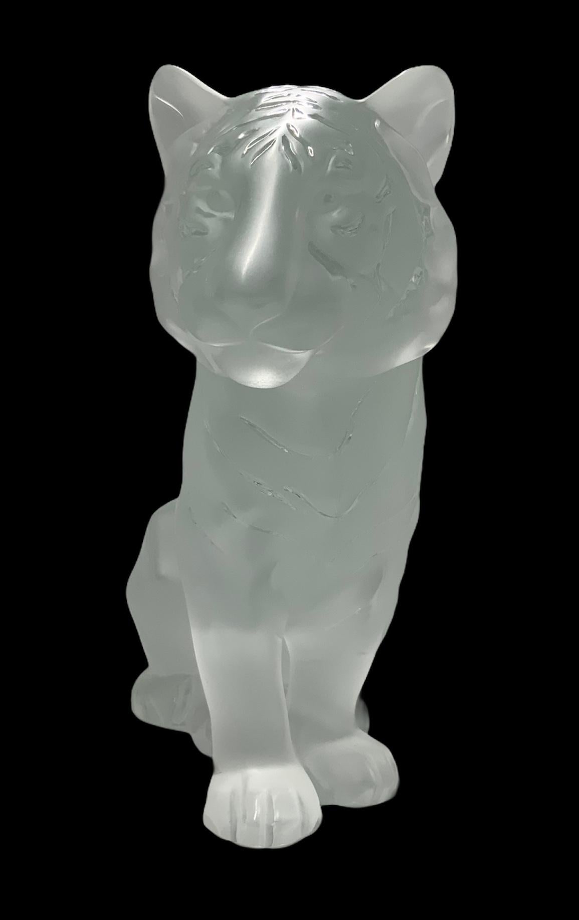 Lalique frosted tiger sculpture showing with its postures and gesture why in Chinese culture it’s considered the king of all beast. It also symbolizes strength and confidence.