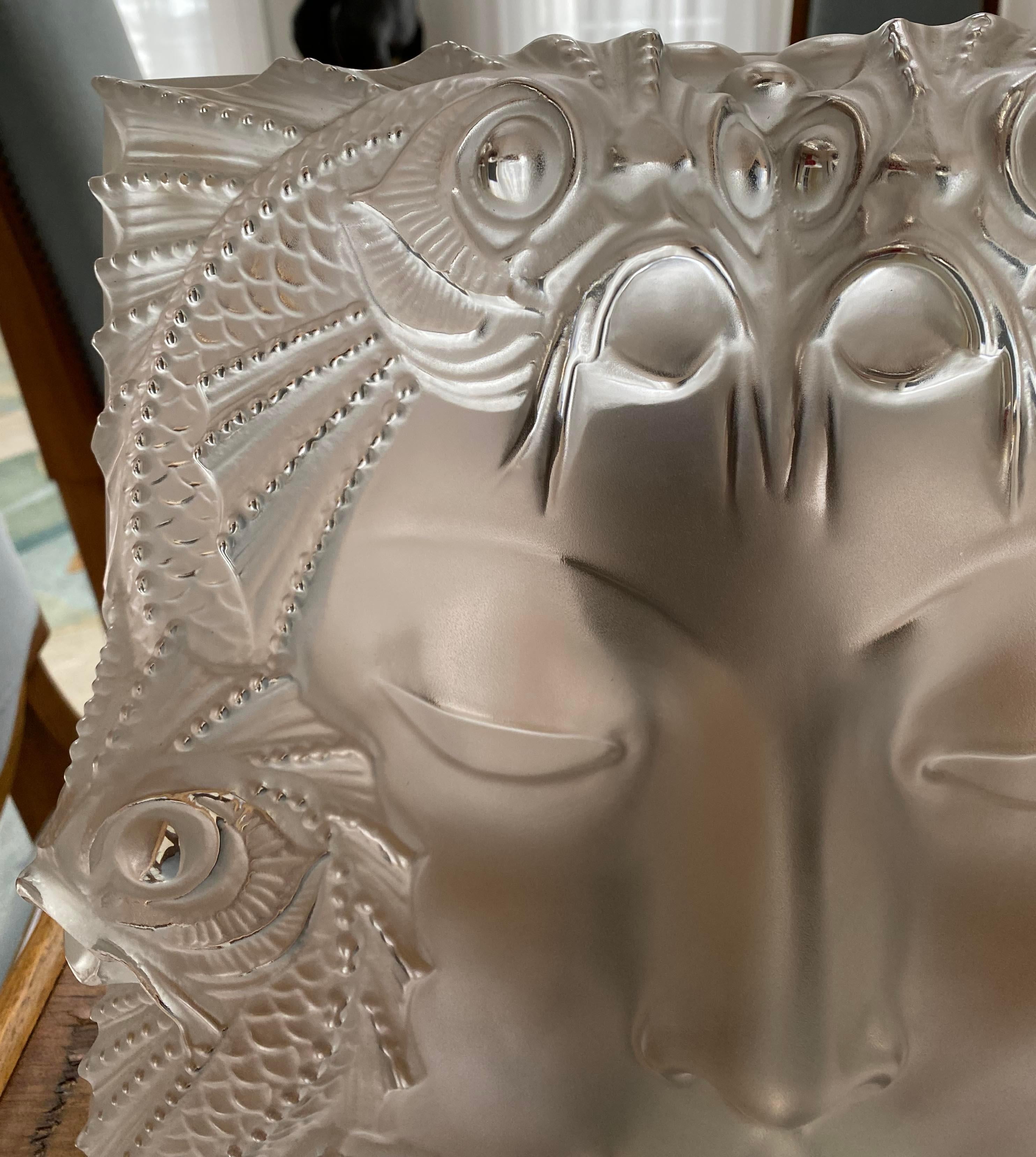 Originally designed in 1935 by Rene Lalique to be placed on top of a fountain and sold after the war as a table decoration, on a nickel plated stand.