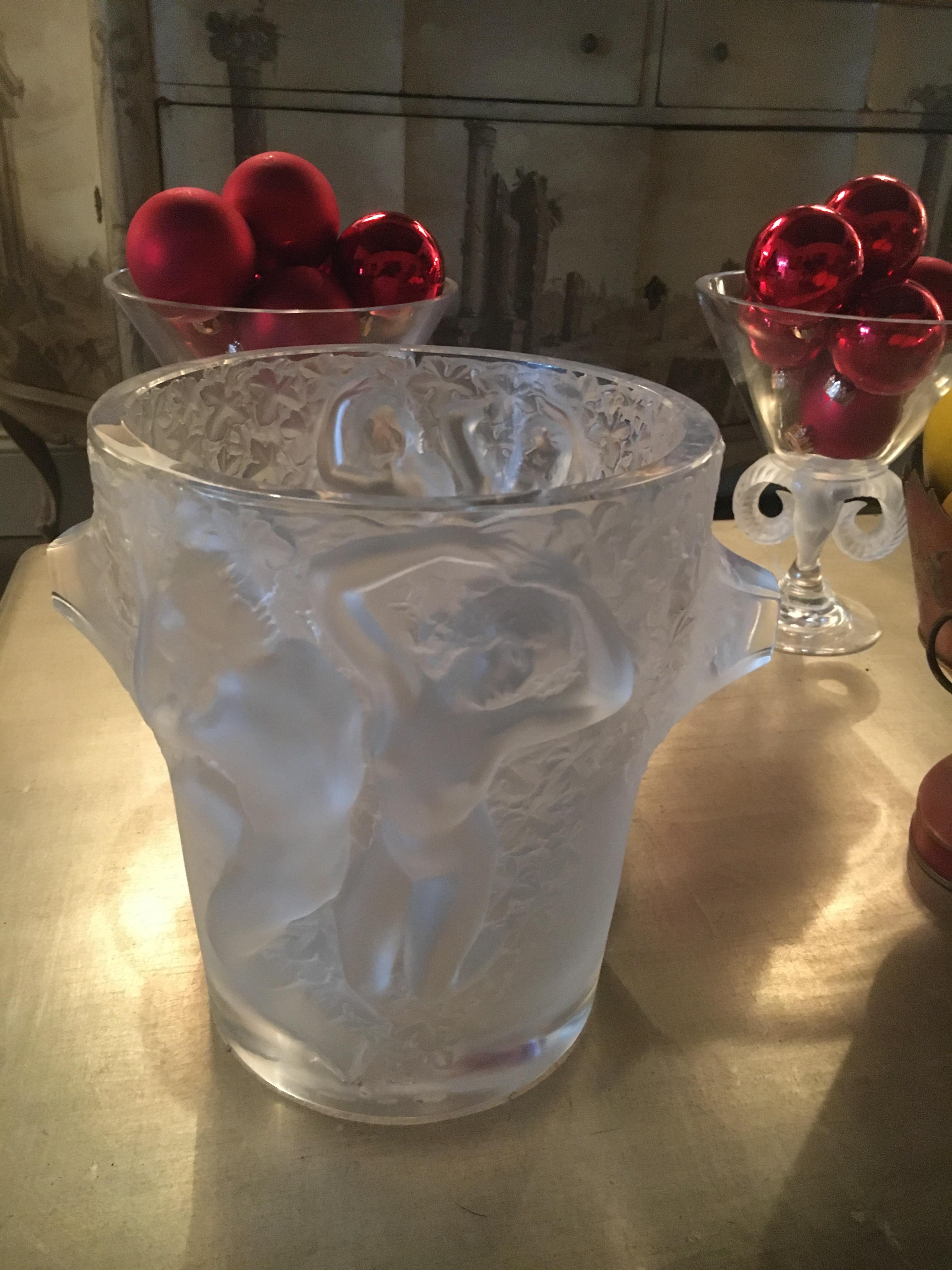 This French crystal champagne cooler/ice bucket was designed in the mid-1950s by Marc Lalique. The design is titled Ganymede after the mythological youth kidnapped by Zeus who eventually went on to serve as his cupbearer. The exterior of the ice